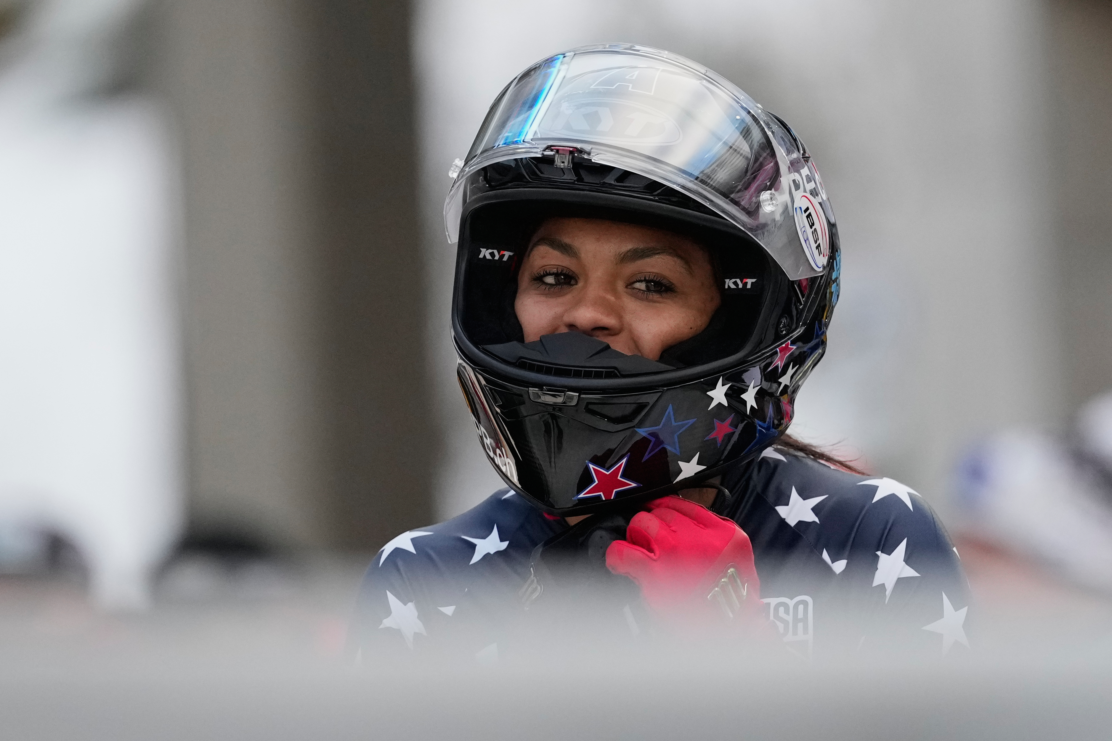 FILE - Winner Kaysha Love of the United States celebrates after the women's monobob race at the Bobsleigh World Cup in Innsbruck, Austria, Saturday, Nov. 29, 2025.