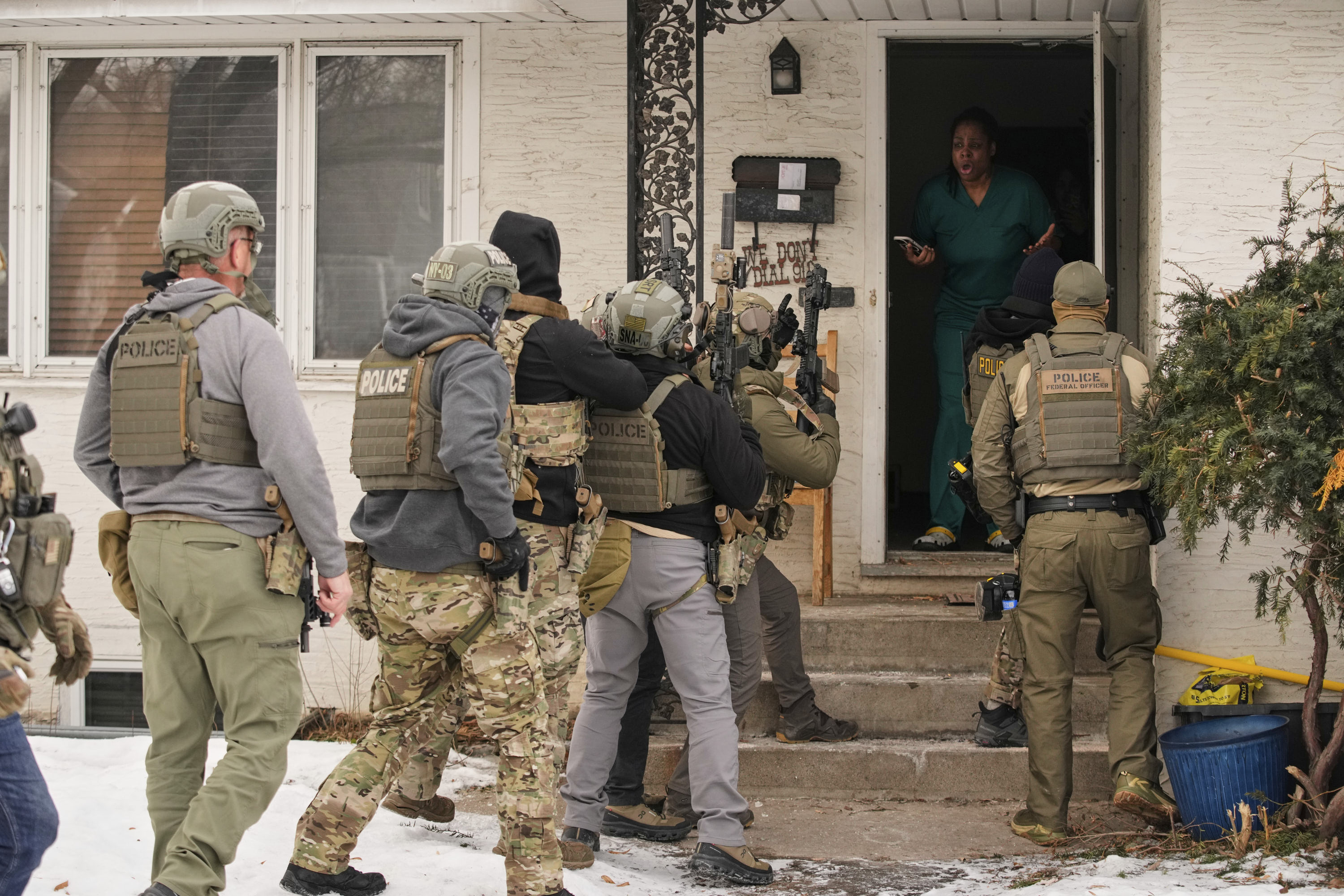 Teyana Gibson Brown reacts after a federal immigration officer used a battering ram to break down her front door in Minneapolis.