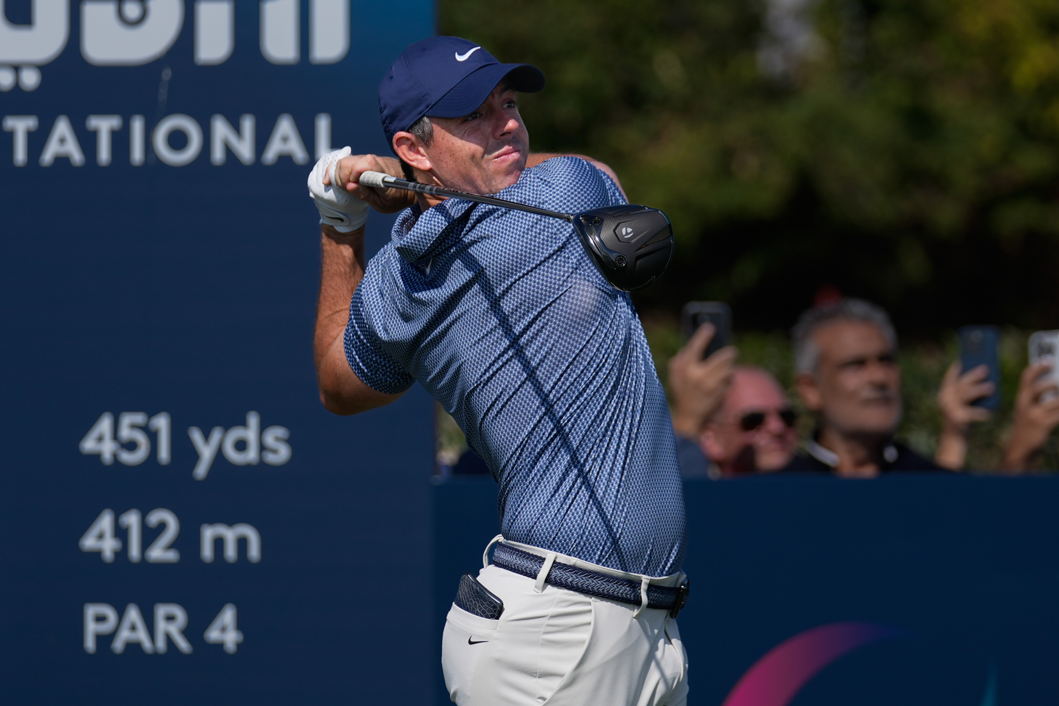 Rory McIlroy of Northern Ireland hits off the first tee during the final round of Dubai Invitational golf tournament in Dubai, United Arab Emirates, Sunday, Jan. 18, 2026.