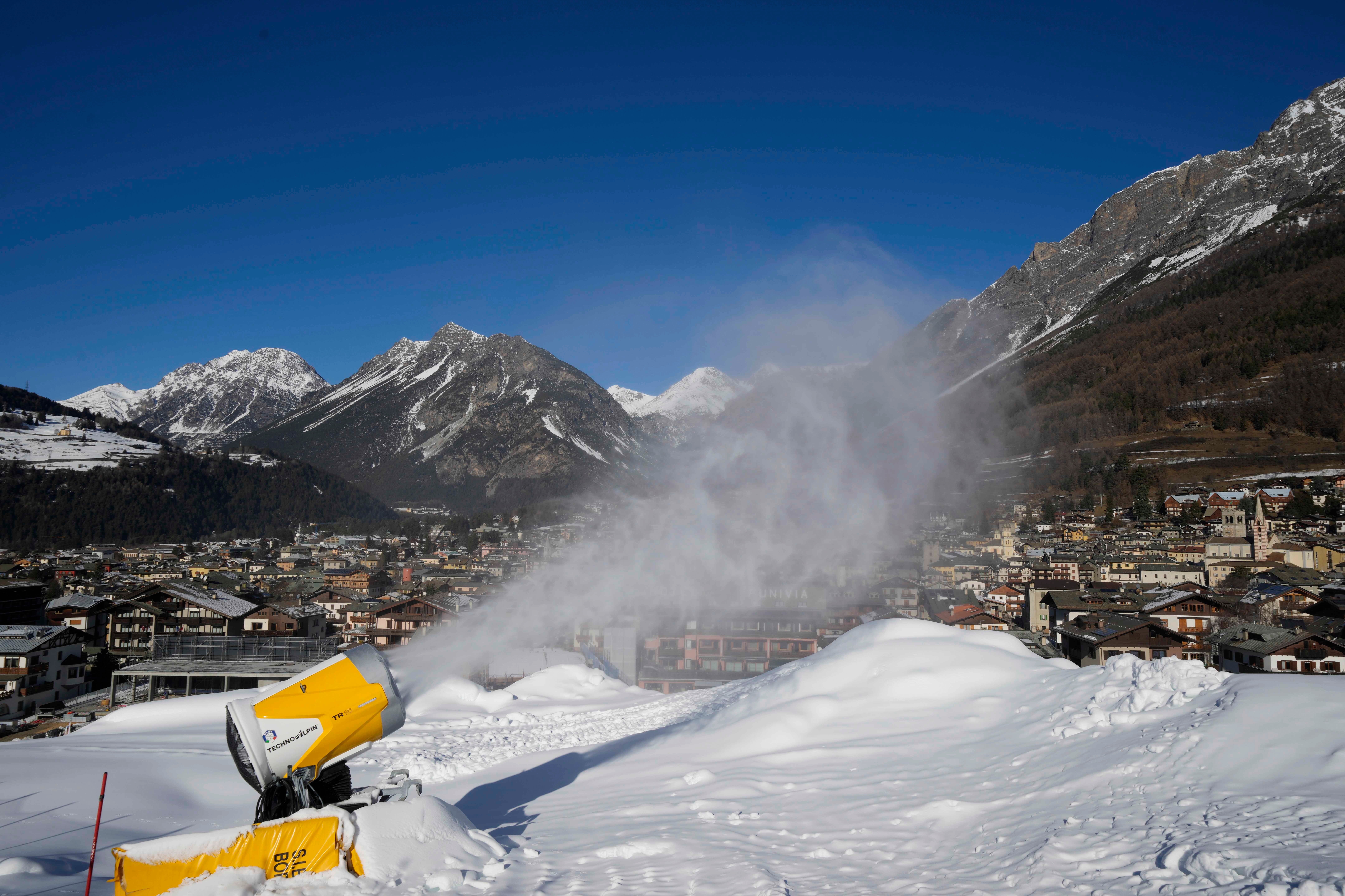 A snow gun sprays artificial snow at the Stelvio Ski Center, venue for the alpine ski and ski mountaineering disciplines at the 2026 Milan Cortina Winter Olympics, in Bormio, Italy, Jan. 16. (AP Photo/Luca Bruno).