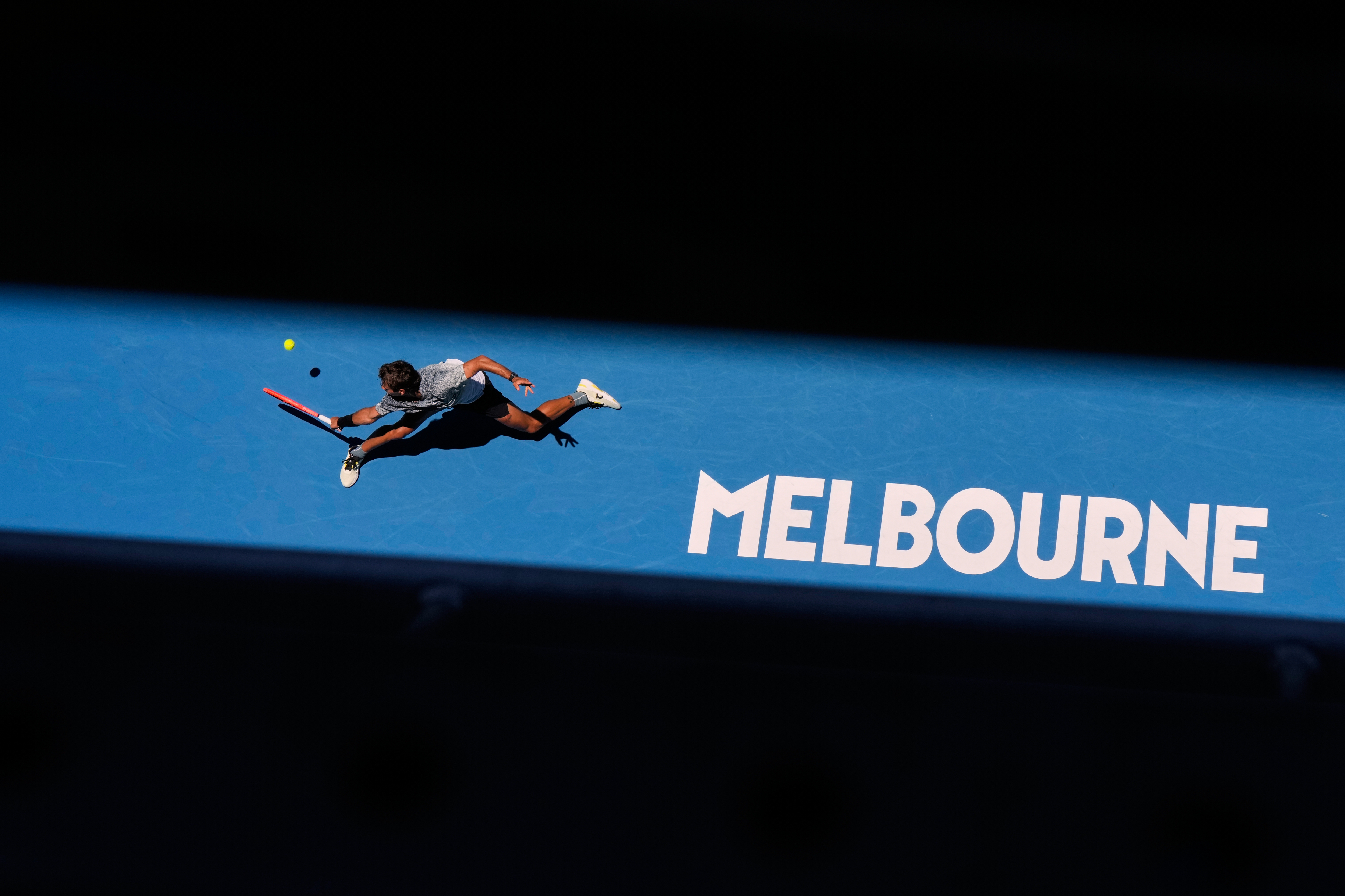 Flavio Cobolli returns the ball to Arthur Fery at the Australian Open in Melbourne