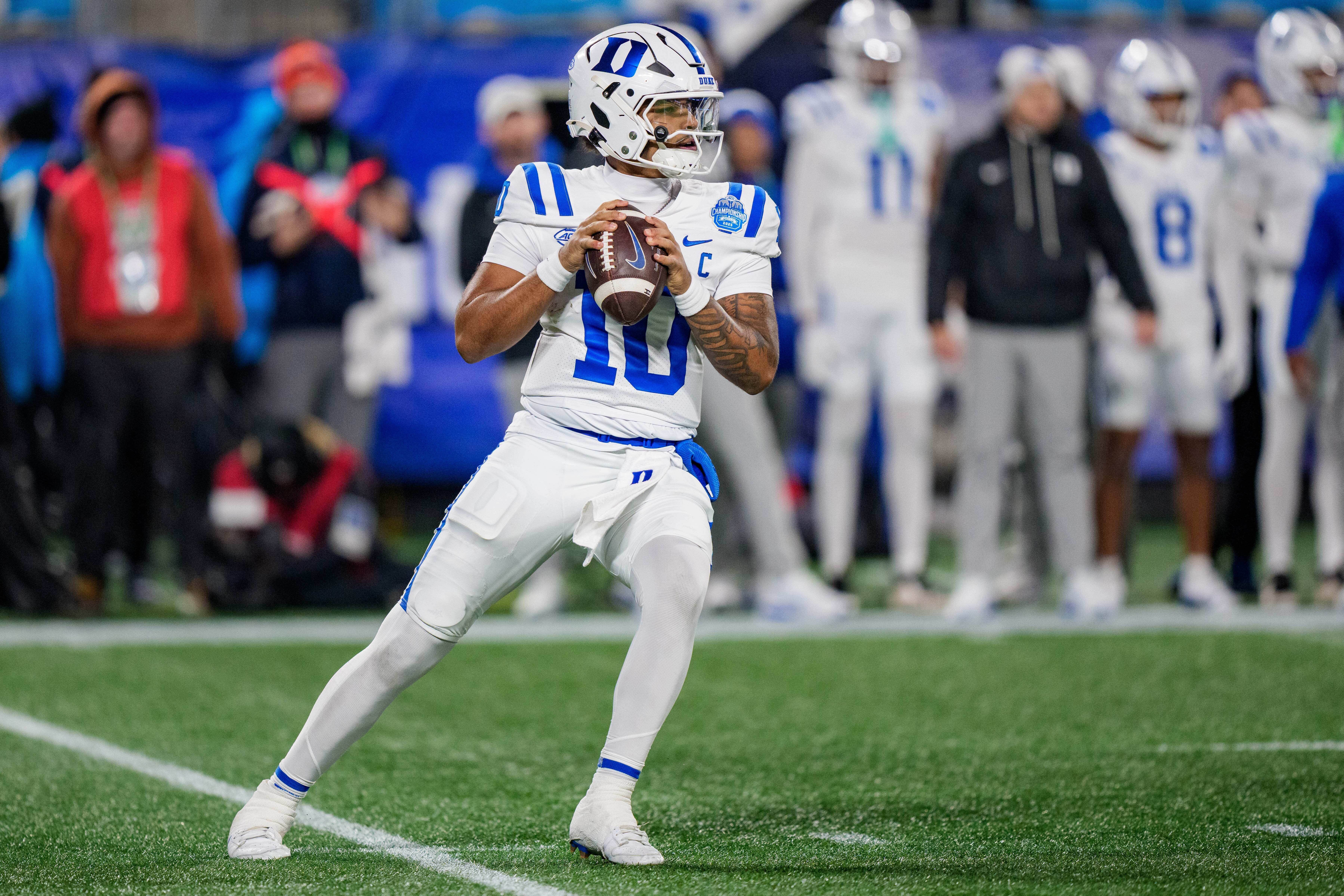 FILE - Duke quarterback Darian Mensah (10) drops back to pass during the Atlantic Coast Conference championship NCAA college football game between Virginia and Duke, Dec. 6, 2025, in Charlotte, N.C.