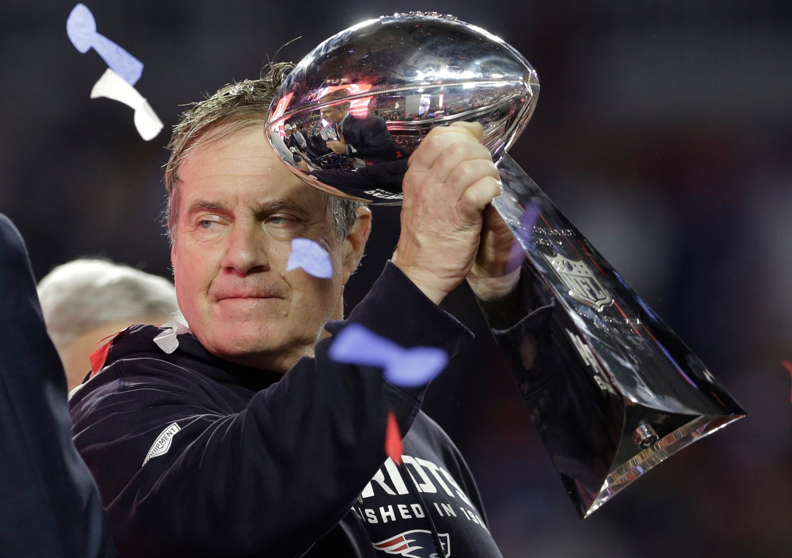 FILE - New England Patriots head coach Bill Belichick holds up the Vince Lombardi Trophy as he celebrates the Patriots' victory over the Seattle Seahawks in NFL Super Bowl XLIX football game Feb. 1, 2015, in Glendale, Ariz.