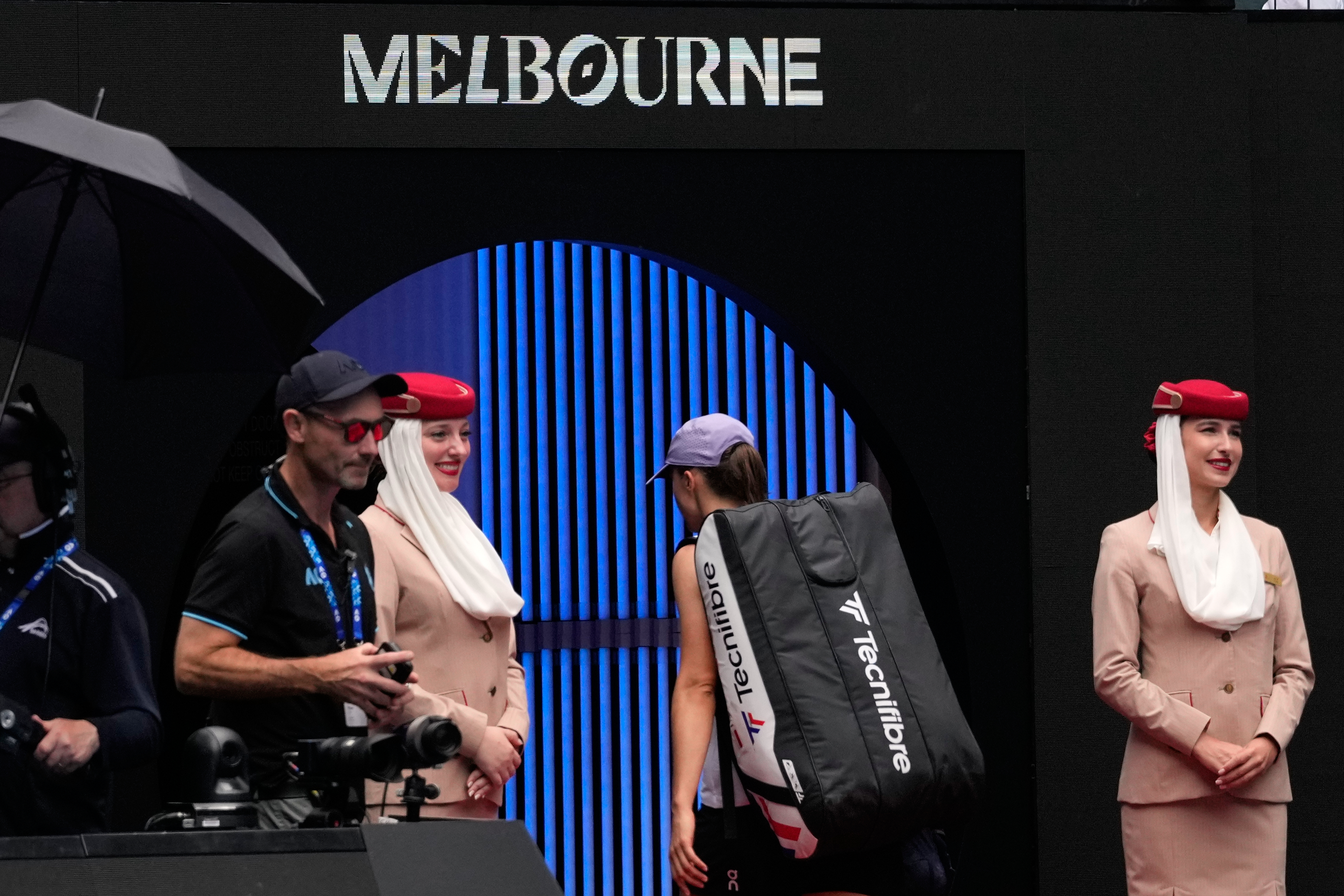 Iga Swiatek of Poland walks from the court following her quarterfinal loss to Elena Rybakina of Kazakhstan at the Australian Open tennis championship in Melbourne, Australia, Wednesday, Jan. 28, 2026.