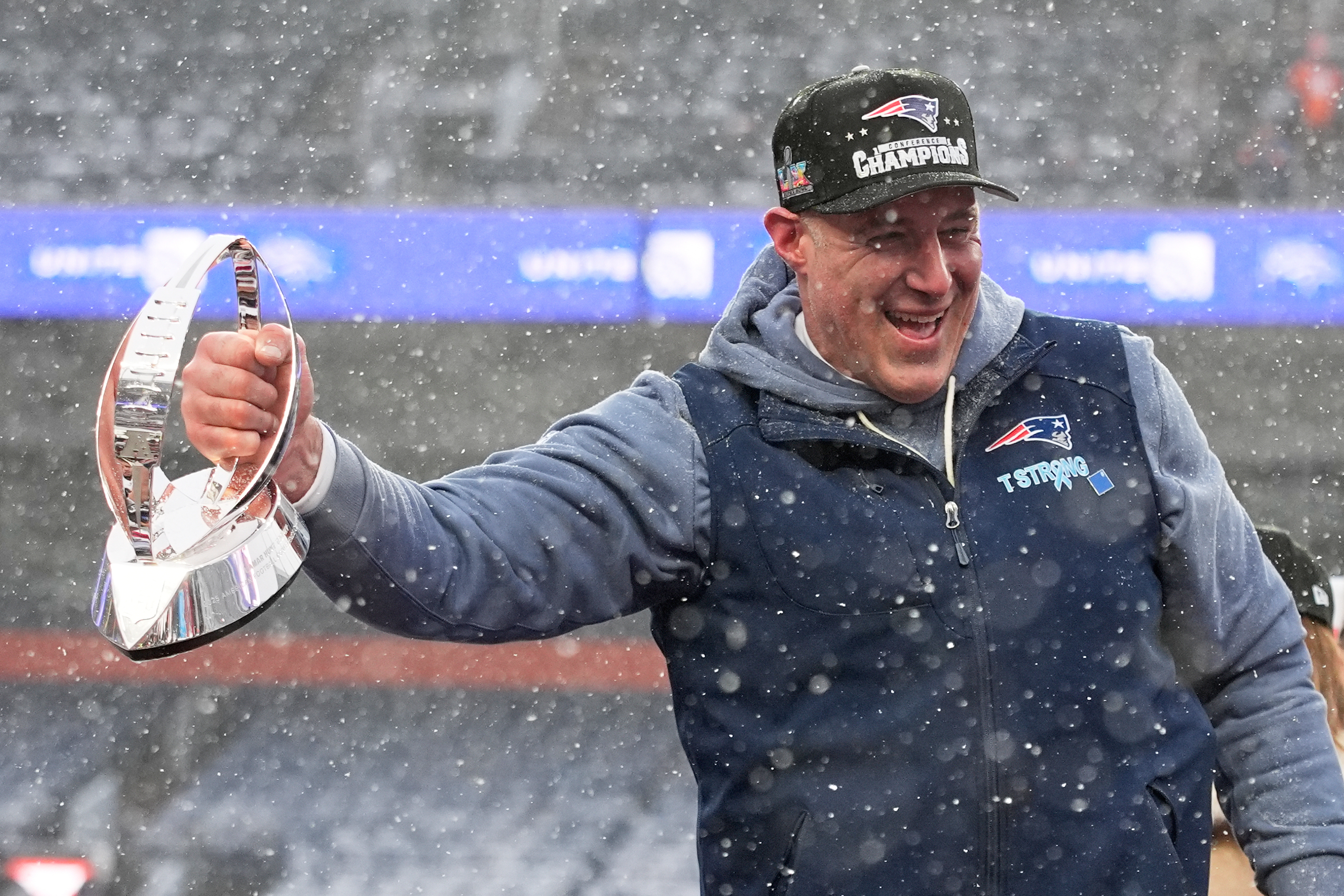 New England Patriots head coach Mike Vrabel celebrates with the trophy after the AFC Championship NFL football game between the Denver Broncos and the New England Patriots, Sunday, Jan. 25, 2026, in Denver.