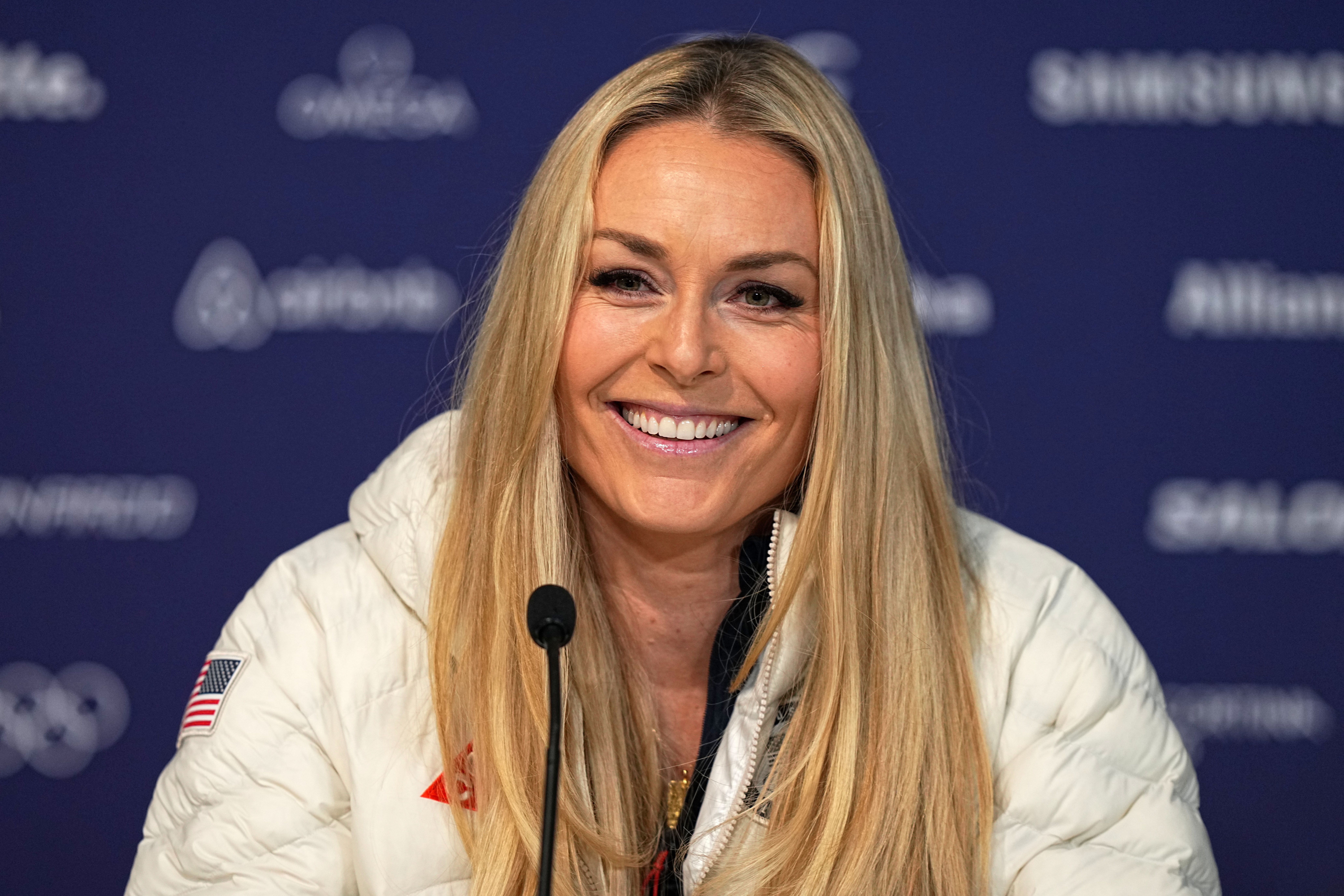 United States' Lindsey Vonn smiles during a press conference by the U.S. ski team at the 2026 Winter Olympics, in Cortina d'Ampezzo, Italy, Tuesday, Feb. 3, 2026.