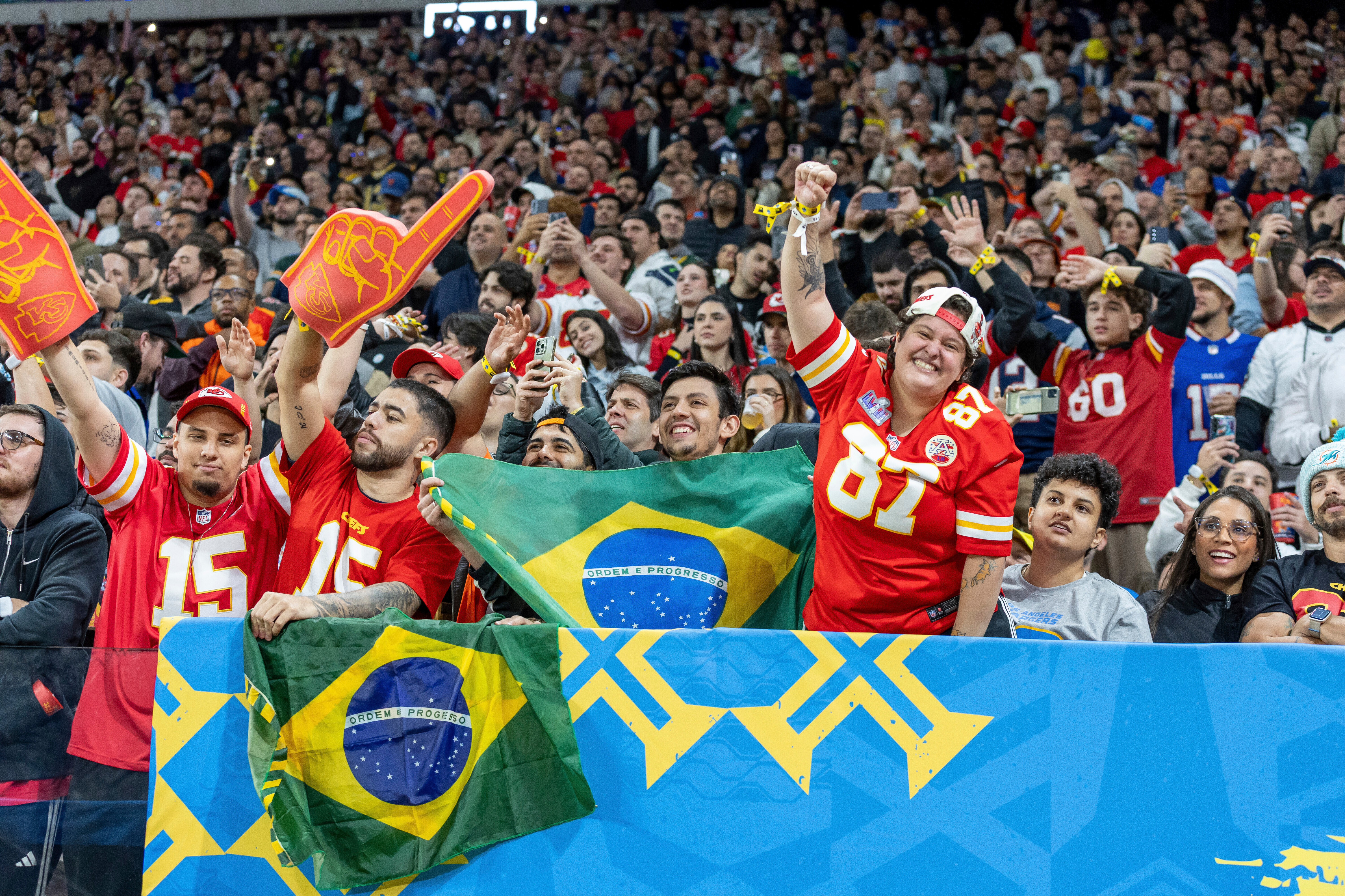 Kansas City Chiefs fans cheer against the Los Angeles Chargers in an NFL football game, Sept. 5, 2025, in São Paulo, Brazil. (AP Photo/Jeff Lewis, File)