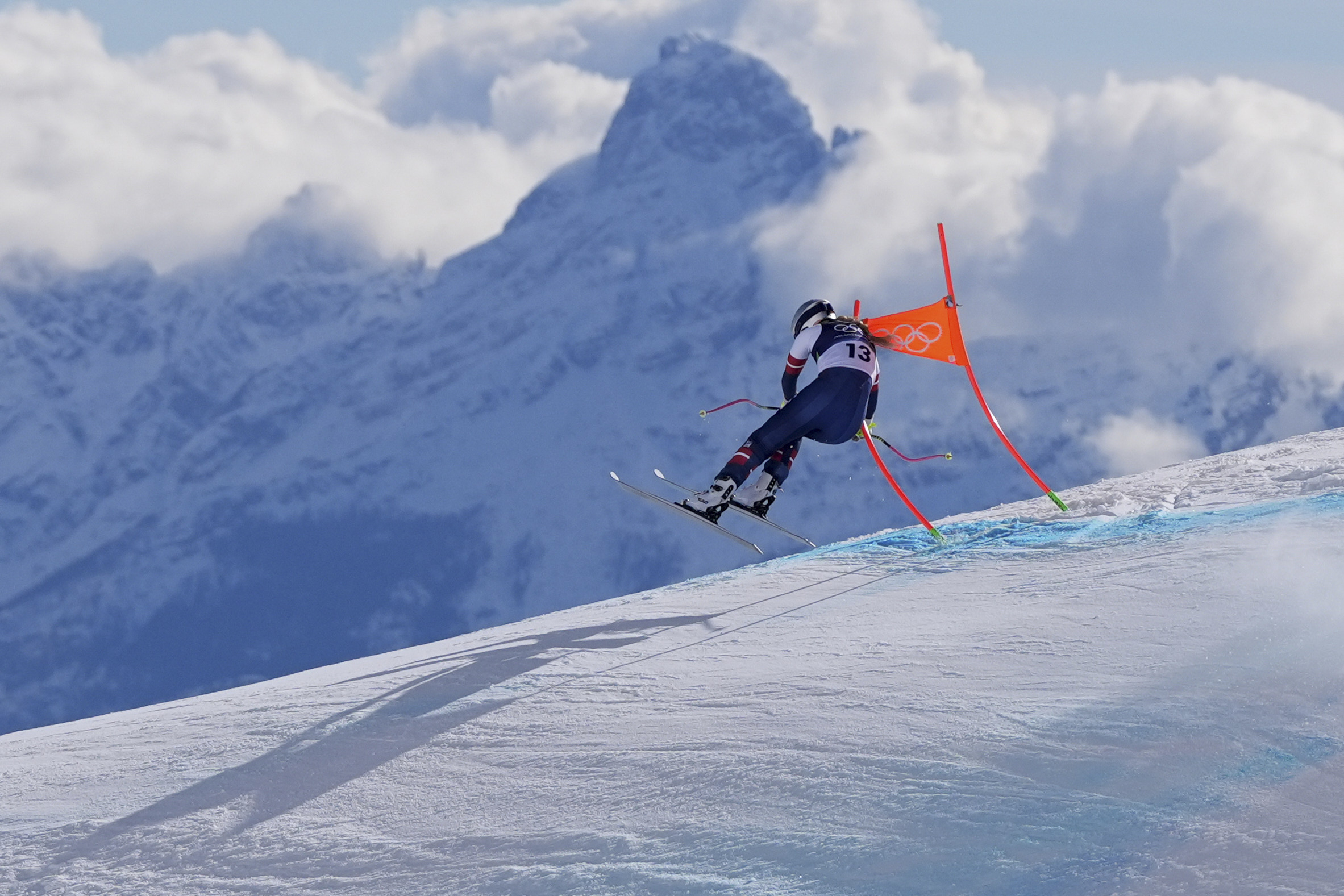 Lindsey Vonn clips the fourth gate during the alpine ski women's downhill race at the Winter Olympics in Cortina d'Ampezzo.
