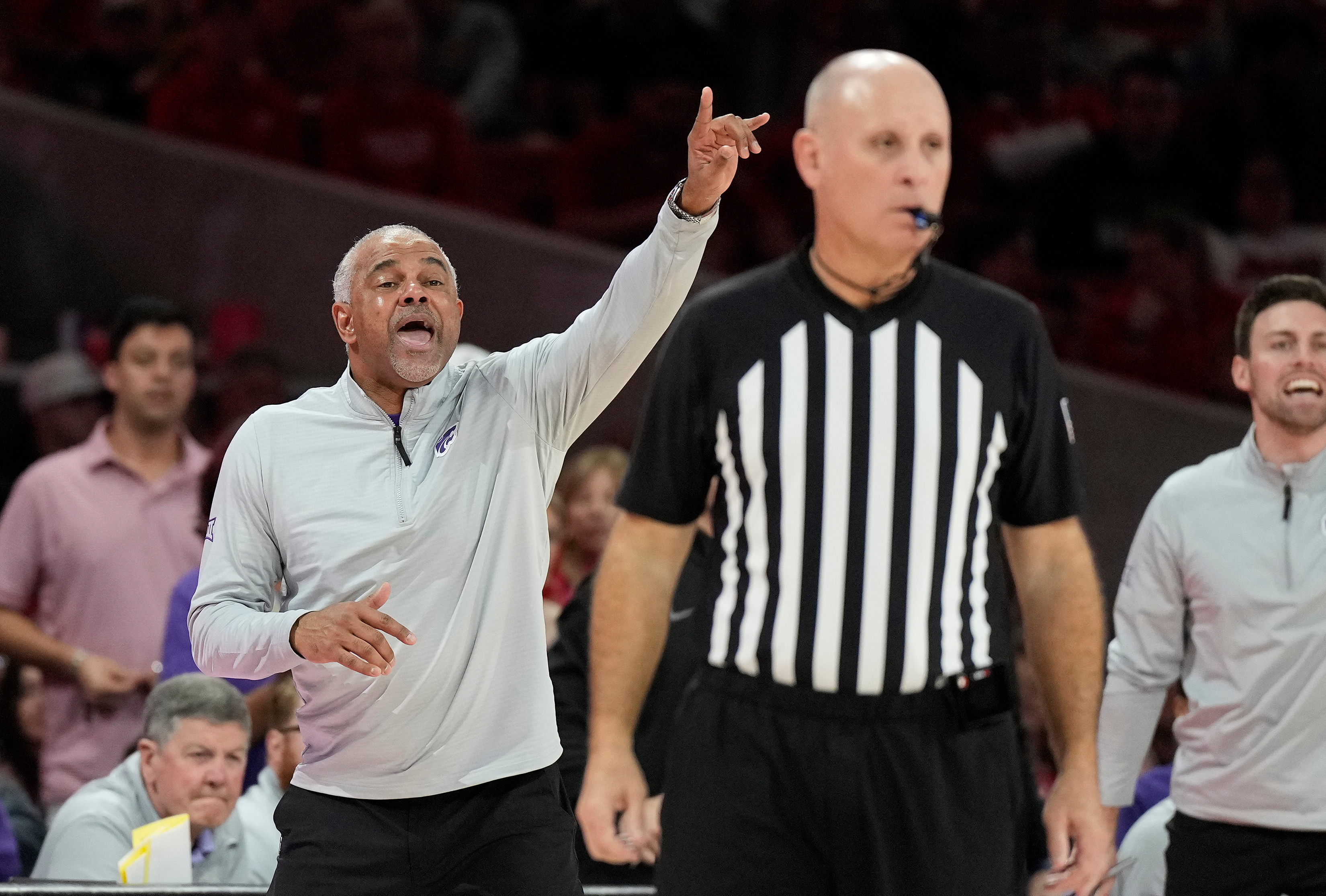 Kansas State head coach Jerome Tang, center left, reacts on the sideline during the second half of an NCAA college basketball game against Houston, Saturday, Feb. 14, 2026, in Houston.