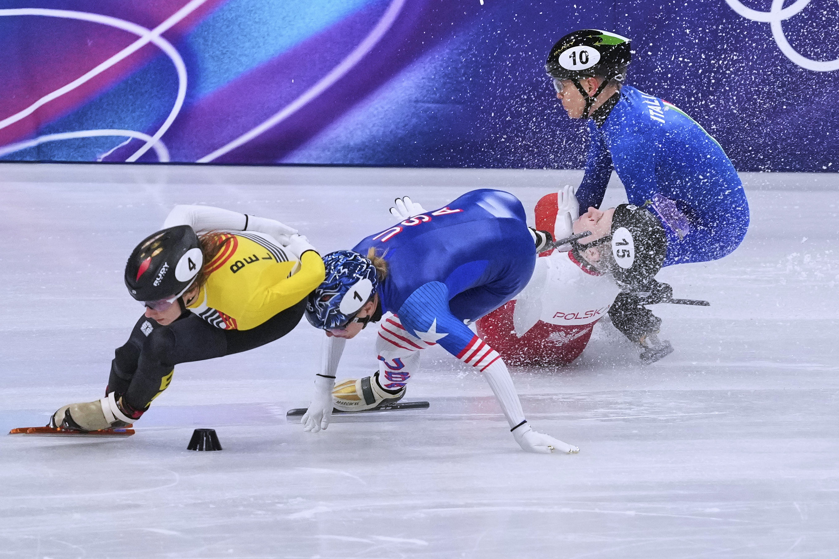 Kamila Sellier of Poland falls during the women's 1,500 meters short track speedskating quarterfinal at the Winter Olympics in Milan, Italy.