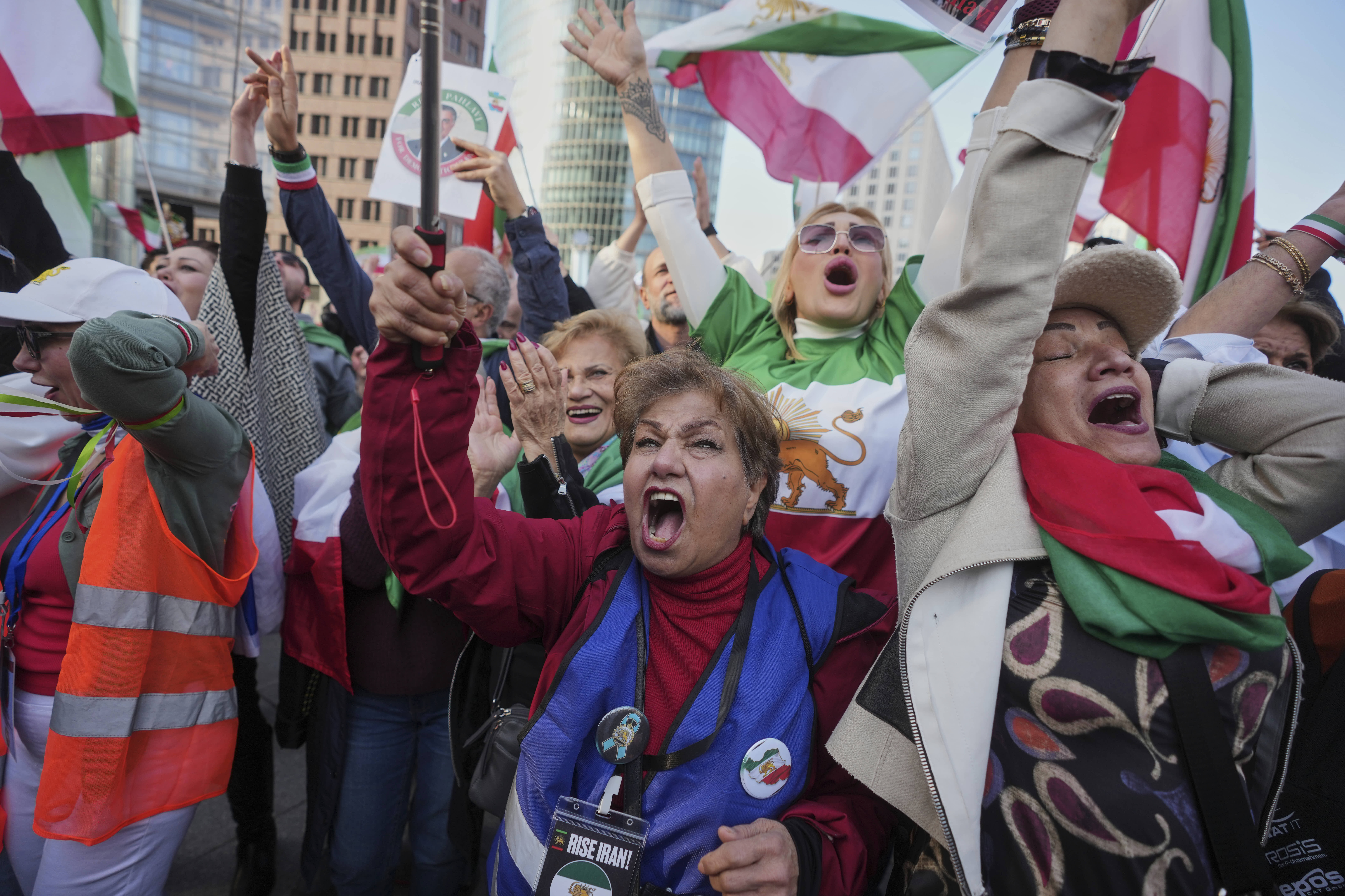 ranian nationals show their support for the U.S. and Israeli strikes on Iran, during a demonstration in Berlin.