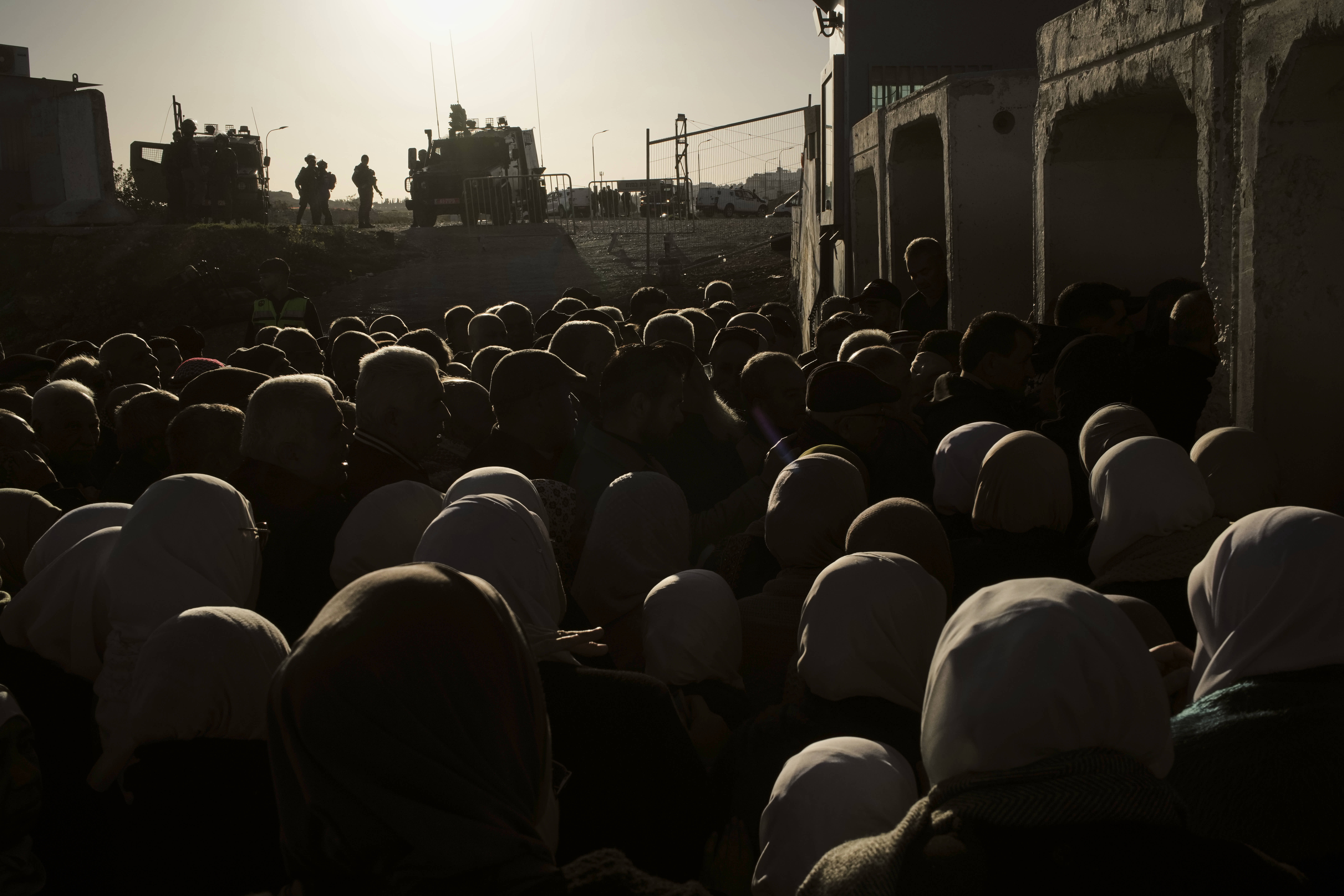 Palestinian worshippers line up to pass through the Israeli military Qalandia checkpoint at the Al-Aqsa Mosque.