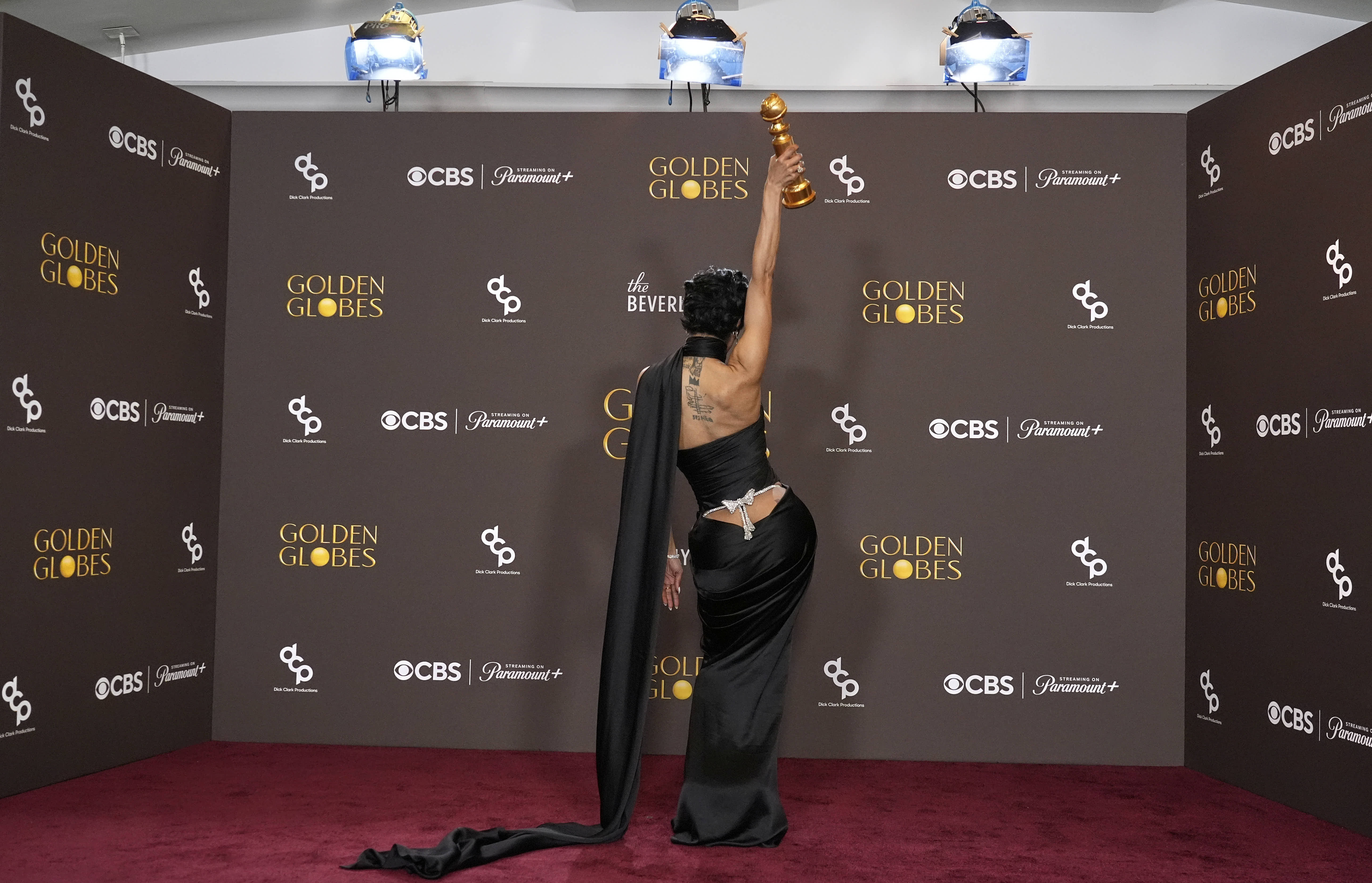 Teyana Taylor strikes a pose with her Golden Globes award for best female actor in a supporting role.