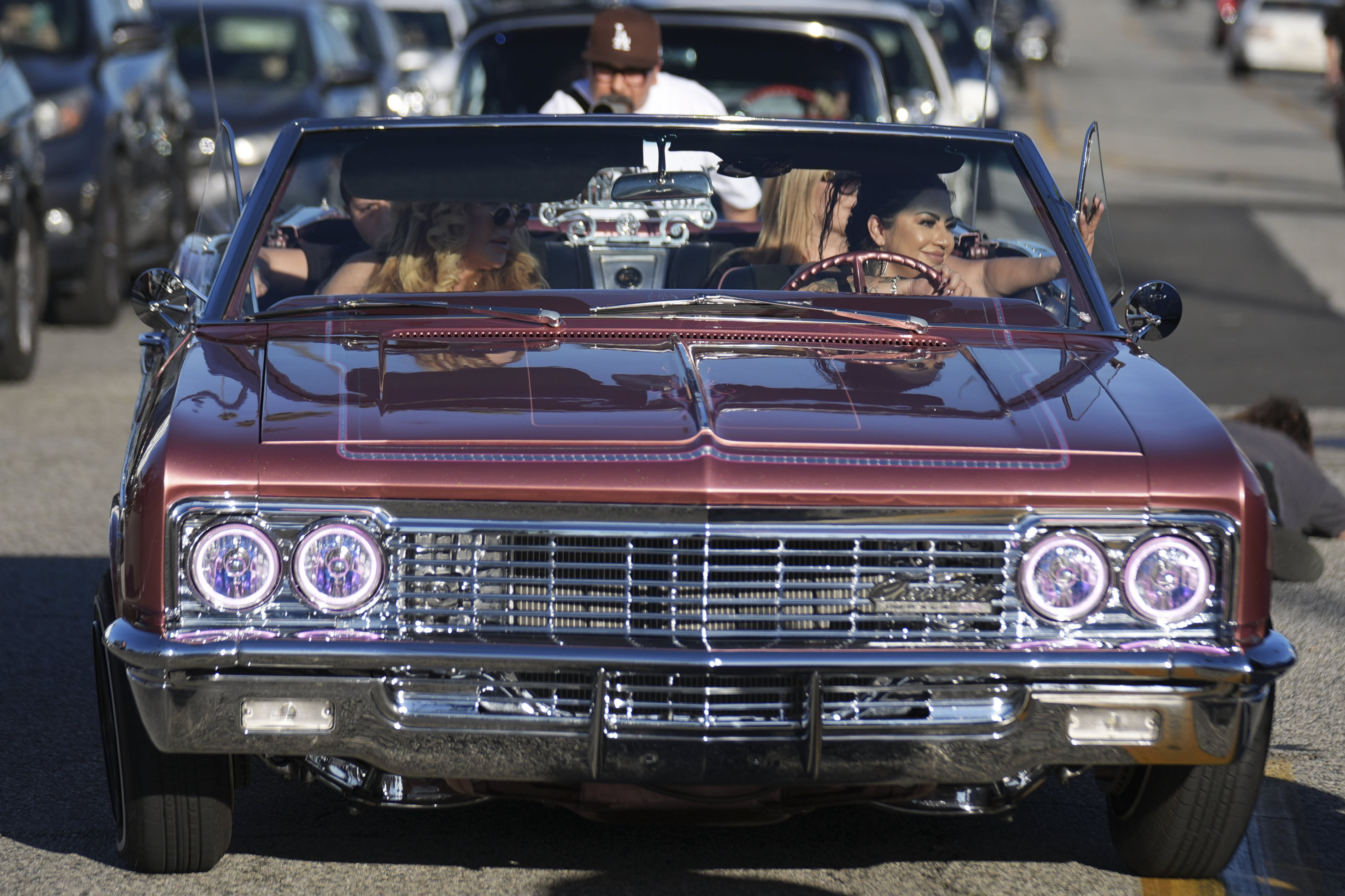 Sandy Avila drives her 1966 Chevy Impala SS at the annual Lady Lowrider Cruise Night in Pasadena, Calif.