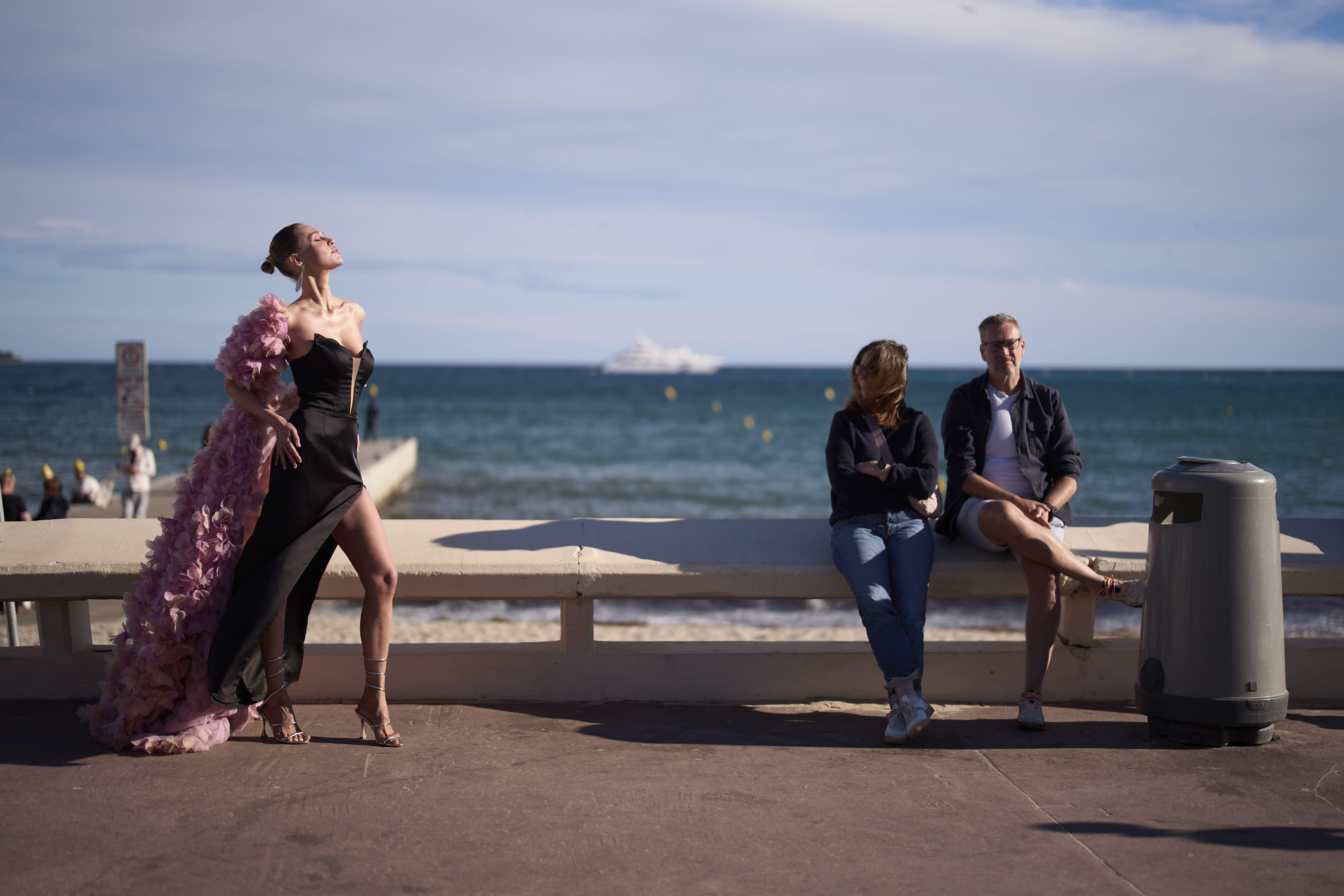 A festival goer strikes a pose on the sidelines of the Cannes Film Festival.