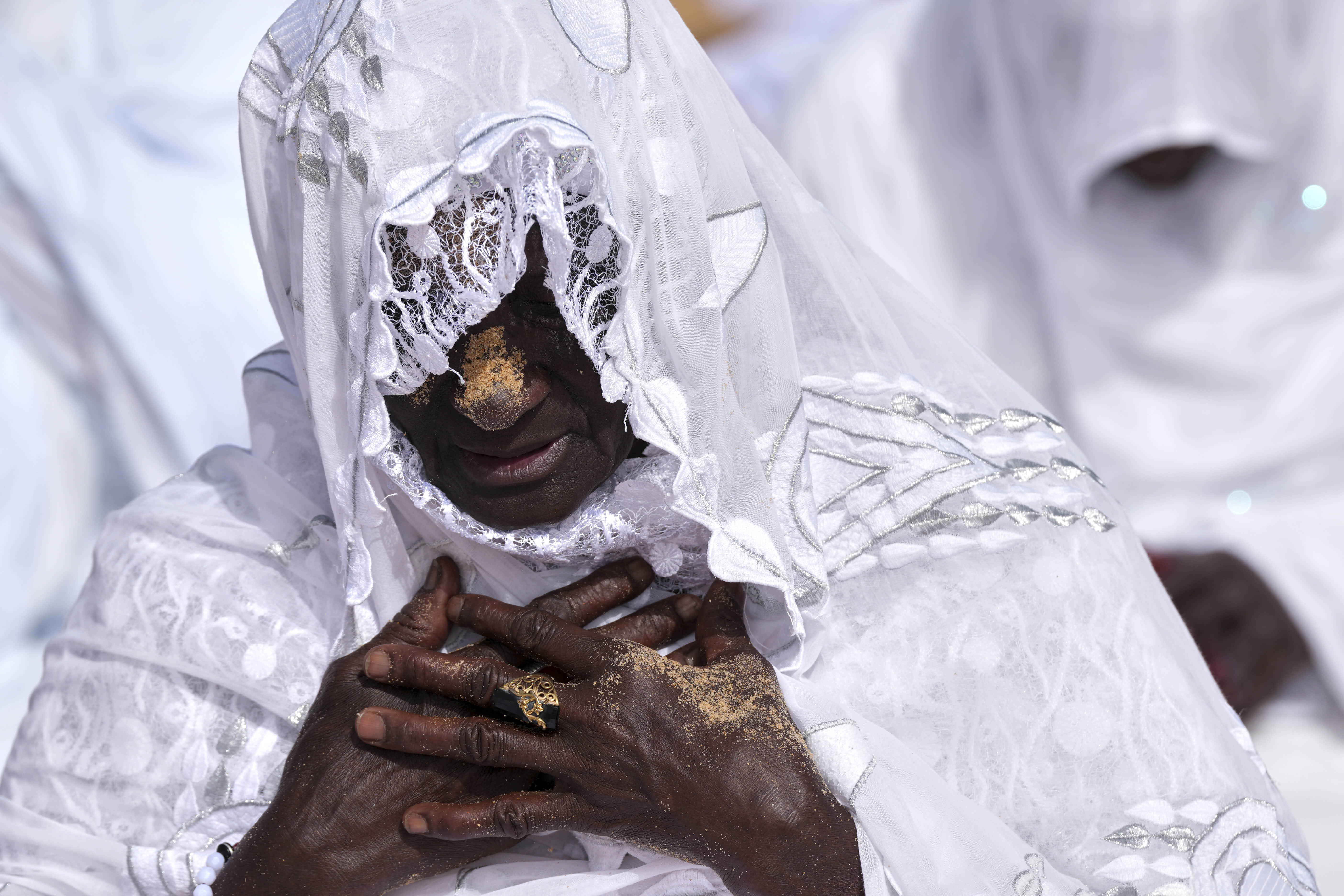 A Muslim woman performs Eid al-Adha prayers in Dakar, Senegal. 