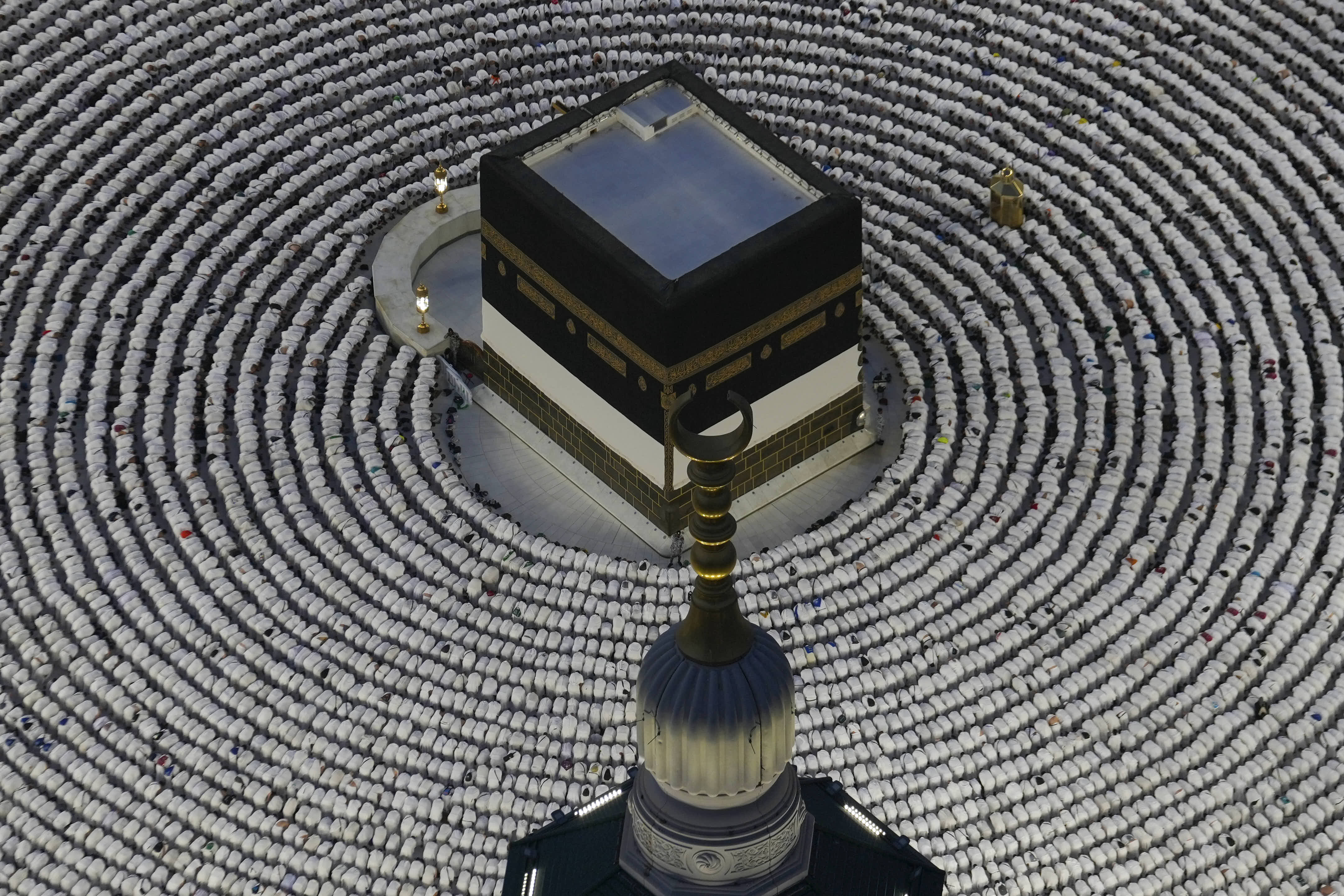 Muslim pilgrims prostrate as they offer evening prayers around the Kaaba, in Mecca, Saudi Arabia.