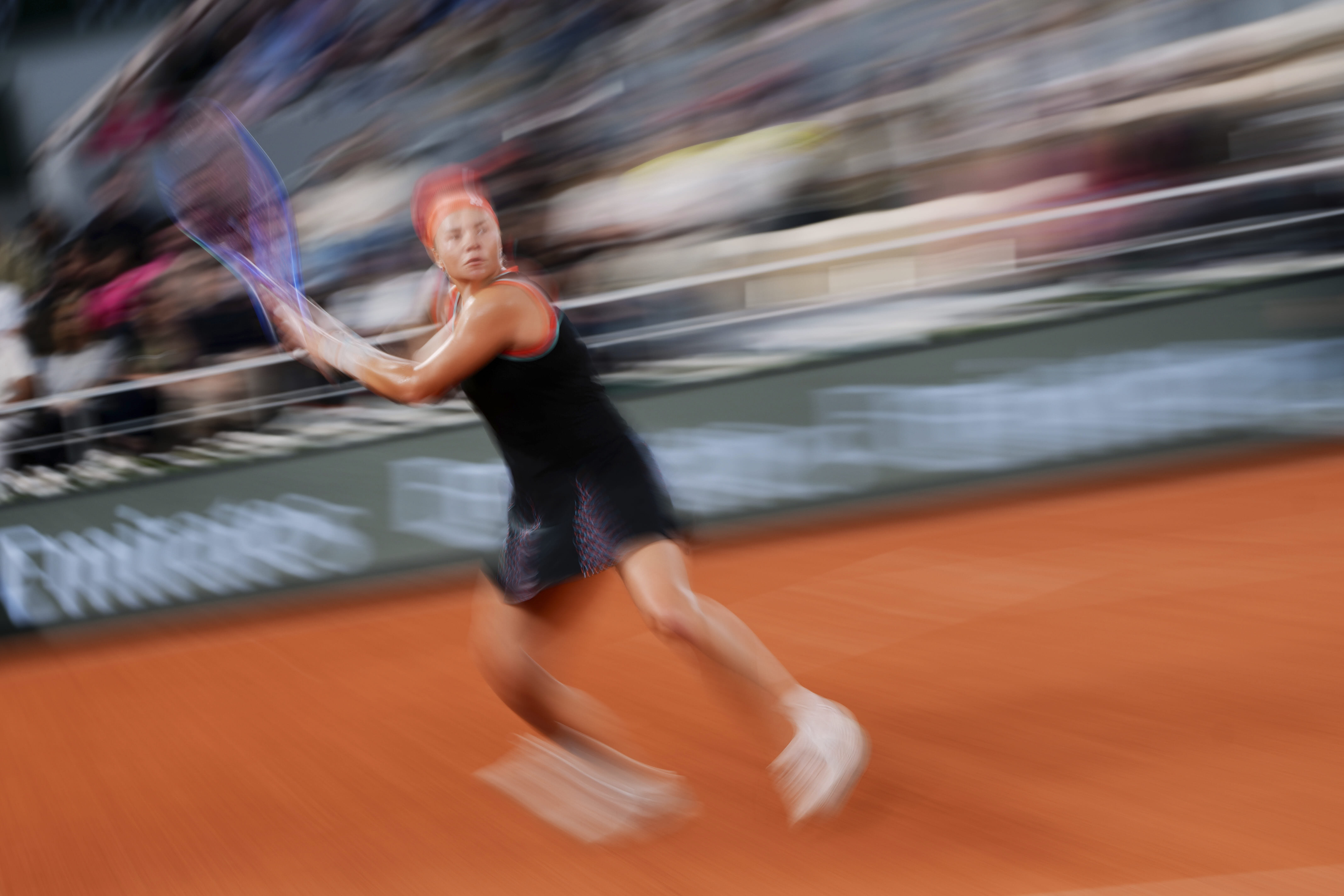 Russia's Diana Shnaider returns a ball during a semifinal match at the French Open in Paris. 