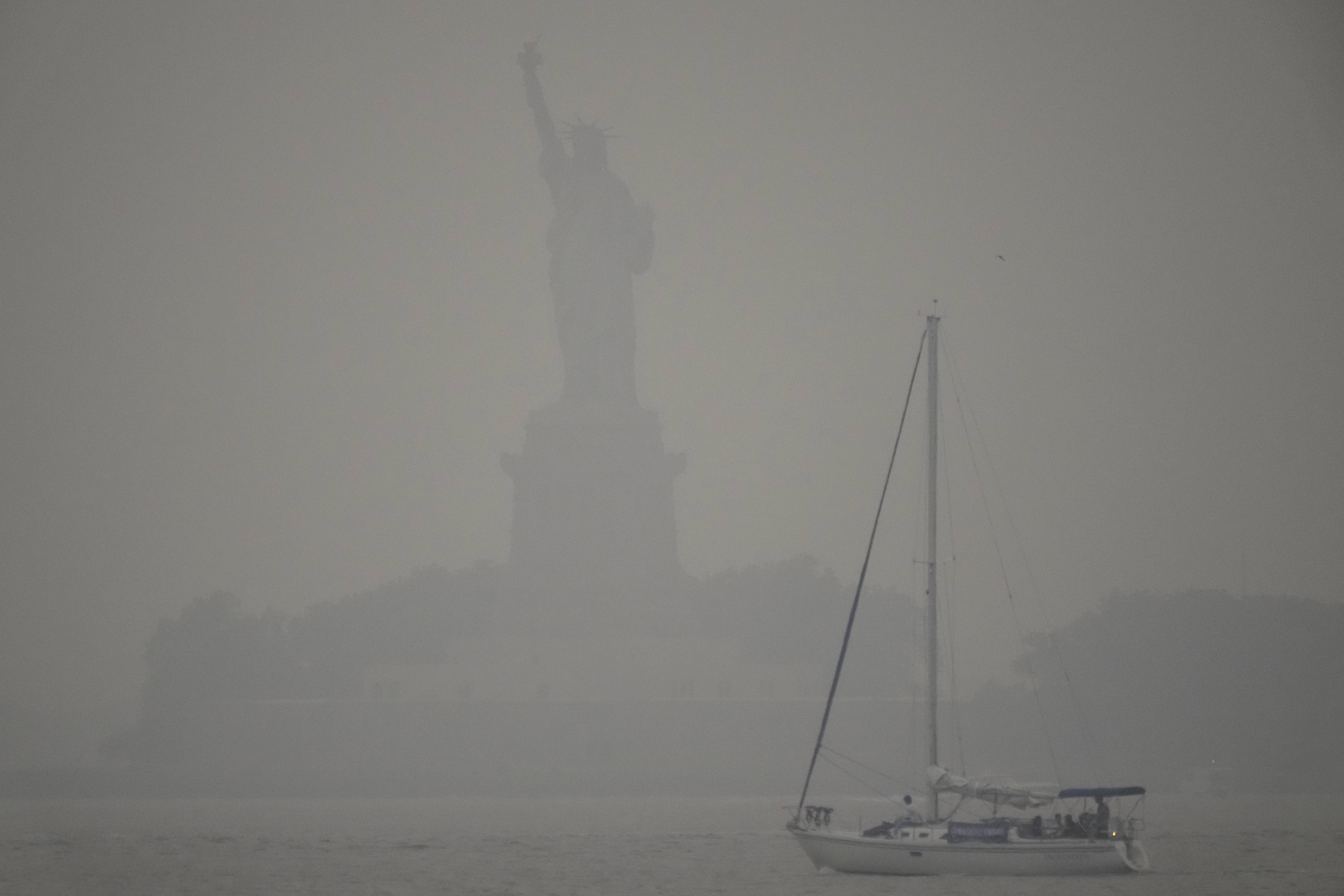 The Statue of Liberty is shrouded in smoke from Canadian wildfires in New York.