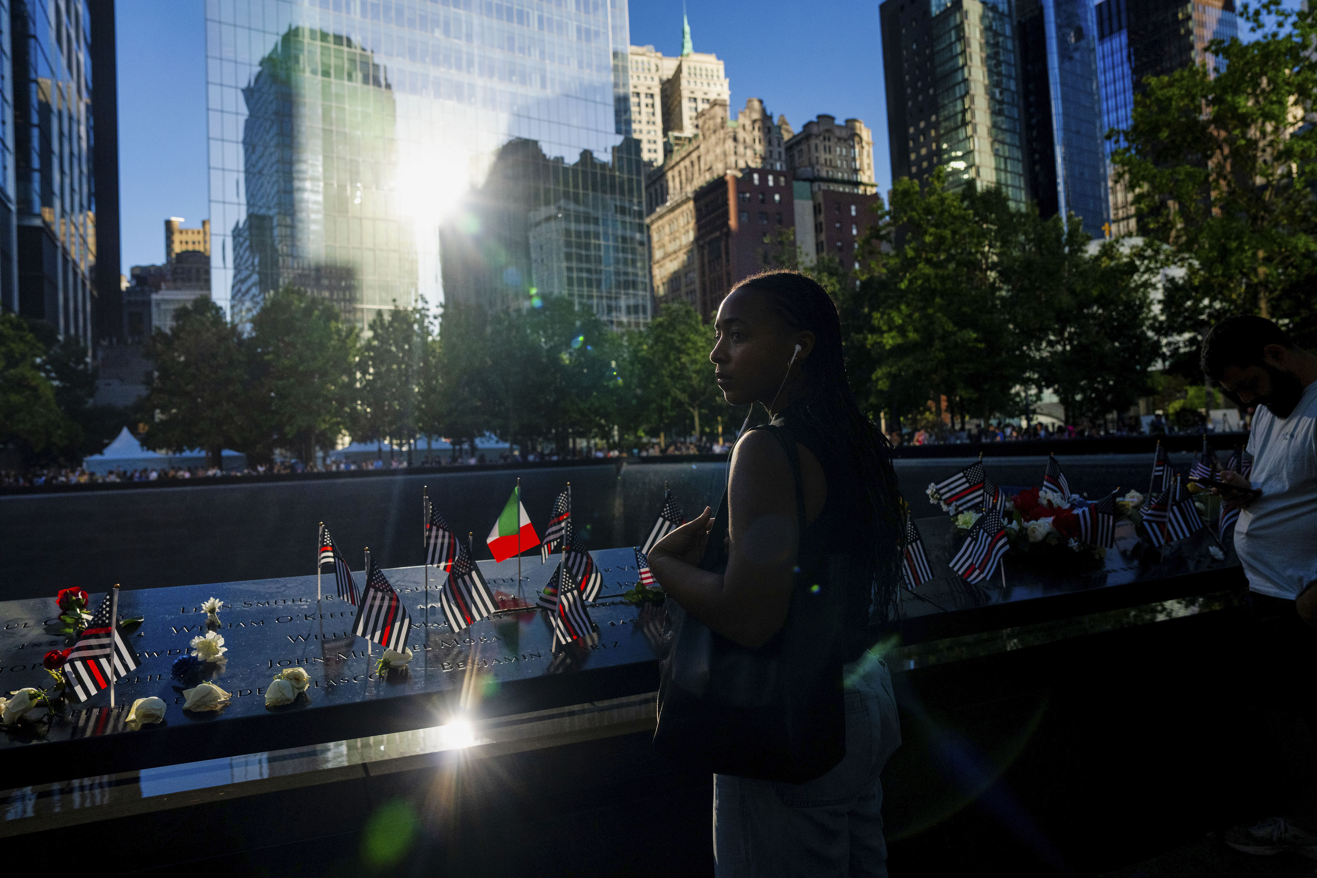 A woman pays her respects on the 25th anniversary of the September 11 World Trade Center attacks in New York.