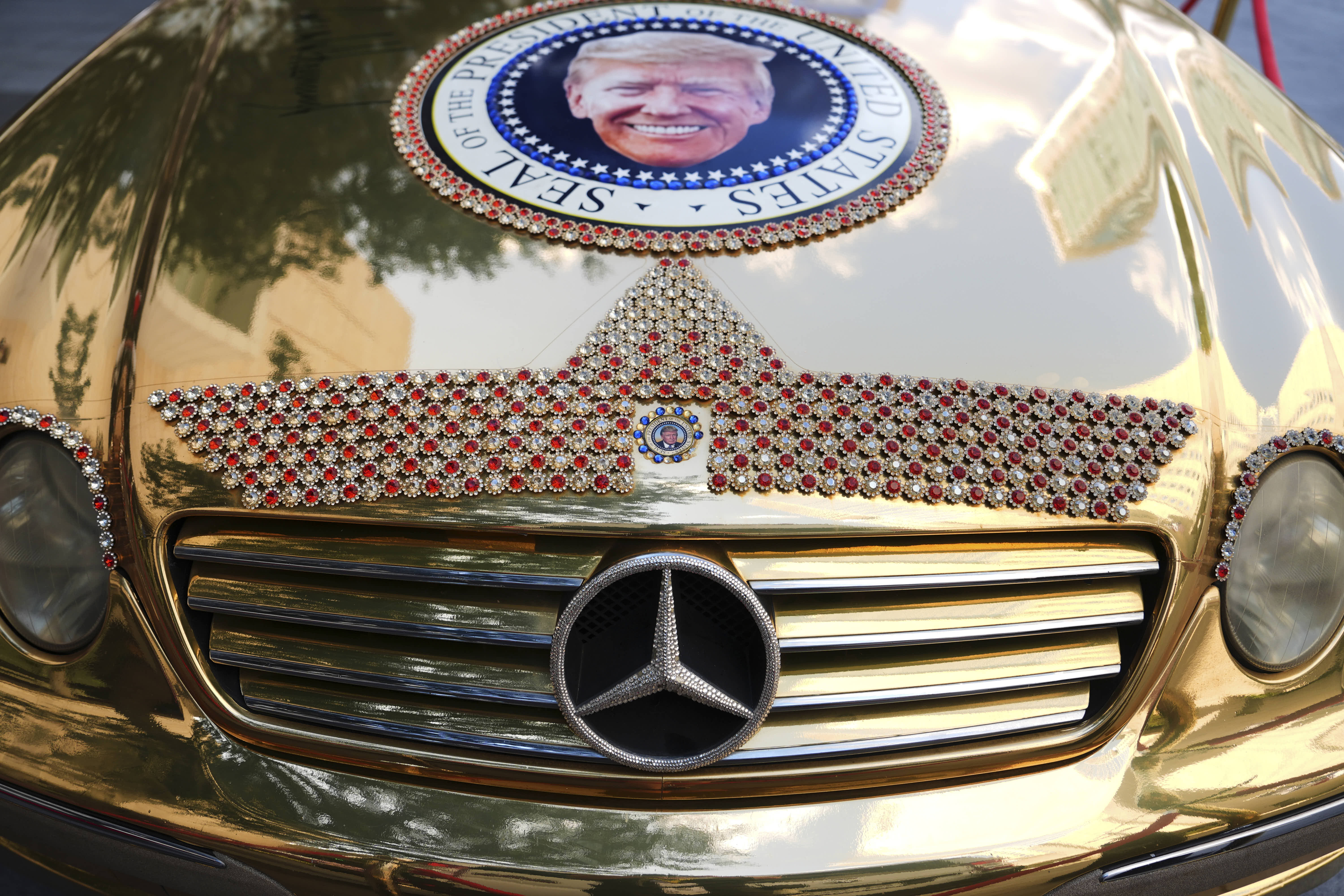 A presidential seal with an image of Donald Trump adorns the hood of a Mercedes at the Republican mid-term convention in Dallas..
