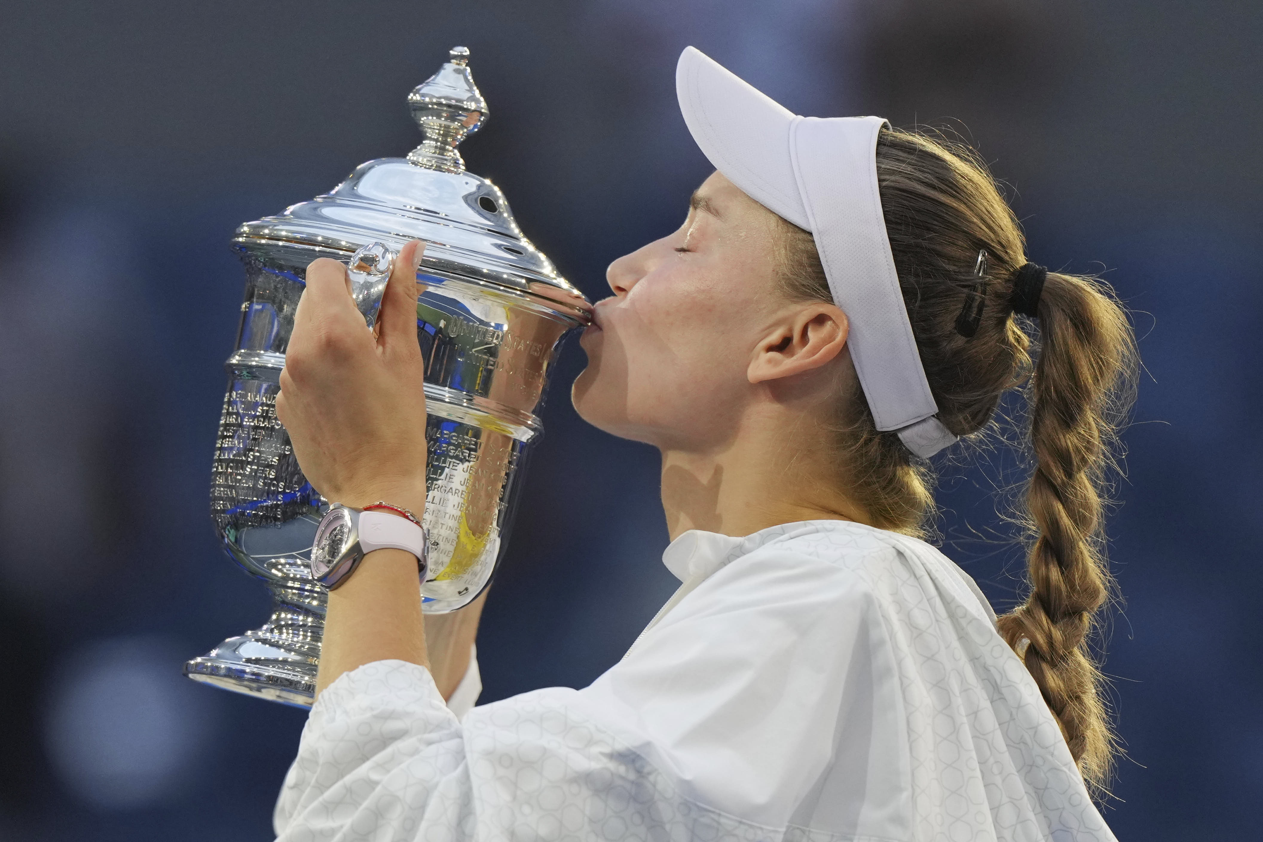 Elena Rybakina kisses the US Open trophy after defeating Aryna Sabalenka in New York.