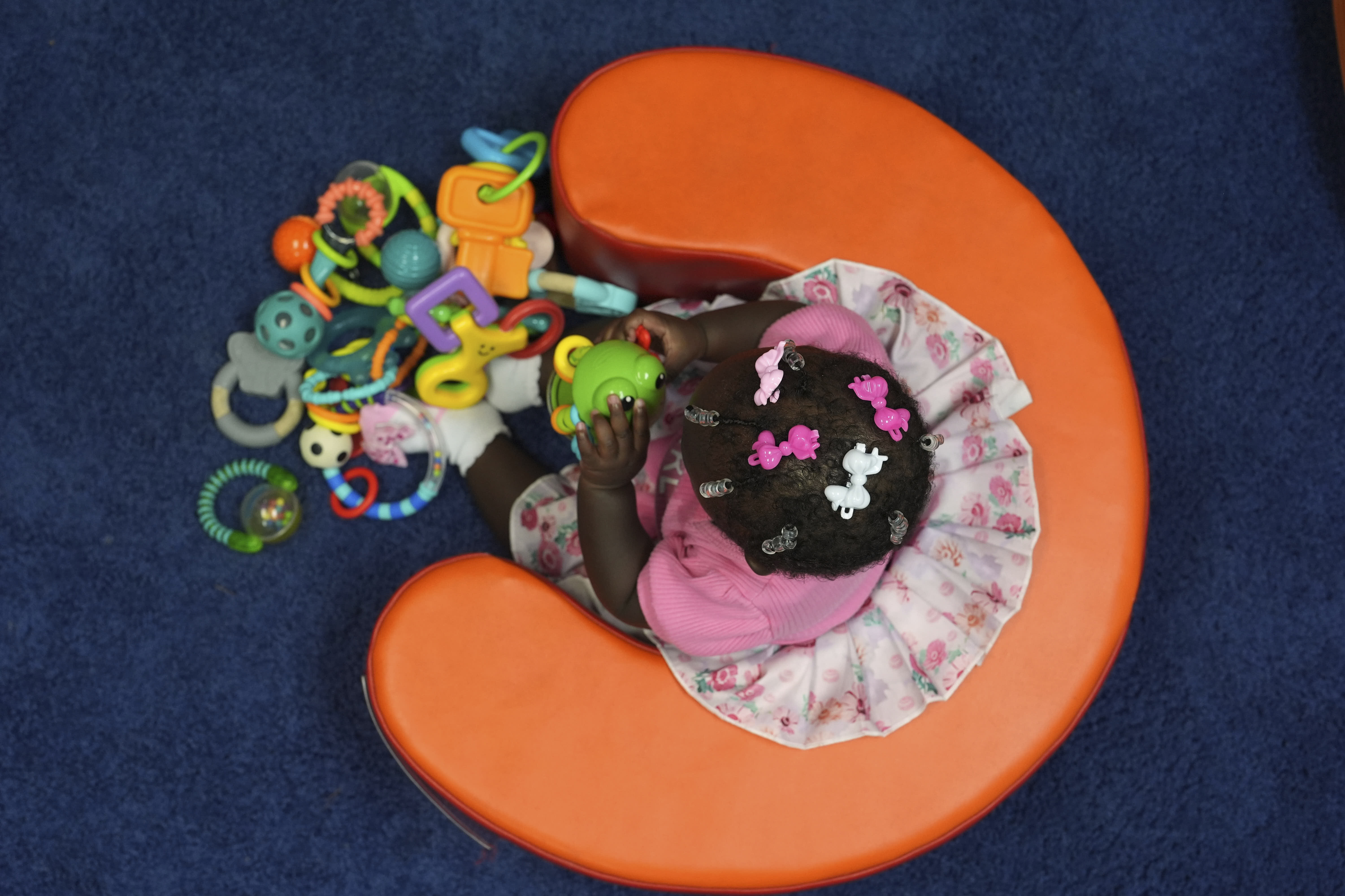 A preschooler plays in a classroom during a Head Start program.