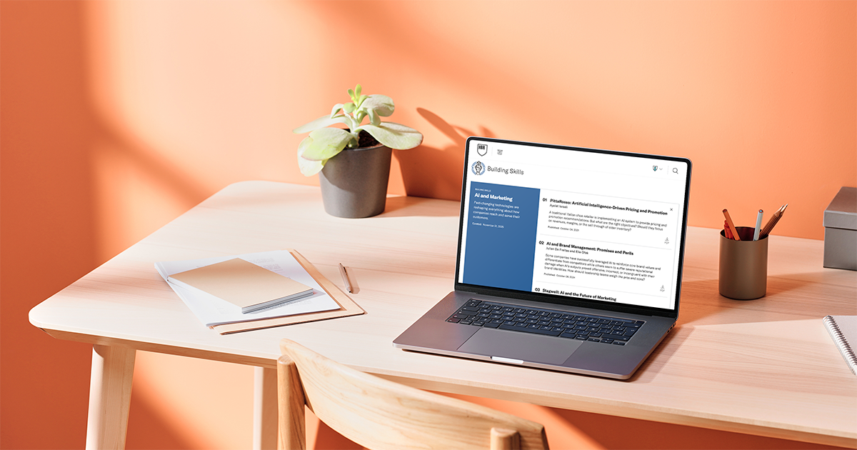 Laptop showing HBS Case Selections from Harvard Business School, featuring AI and marketing case studies within the Building Skills collection.
