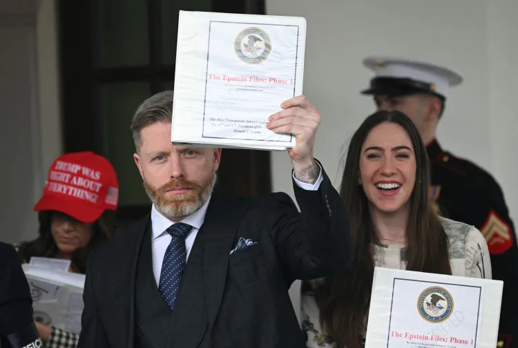 Donald Trump supporters hold up the supposed Epstein Files
