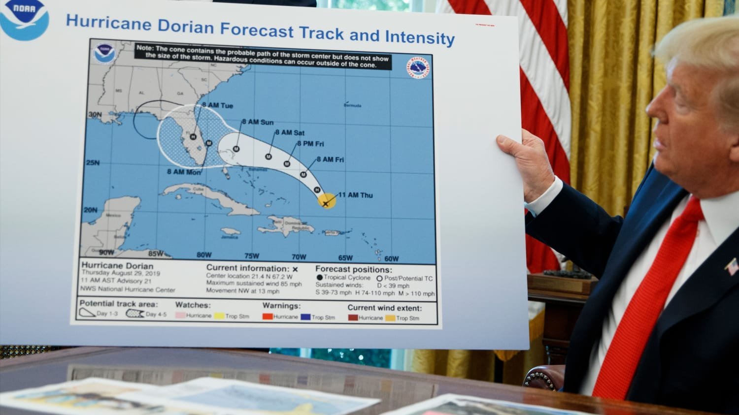 Trump looking at Hurricane Dorian forecast chart