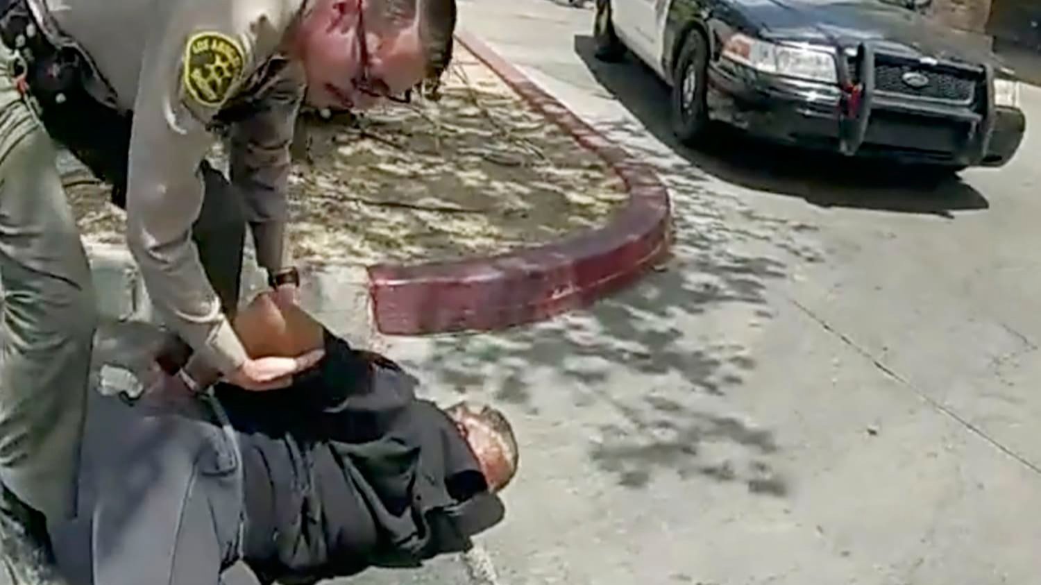 Deputy Trevor Kirk arresting a couple