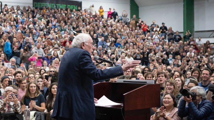 Bernie Sanders speaking to a large crowd.