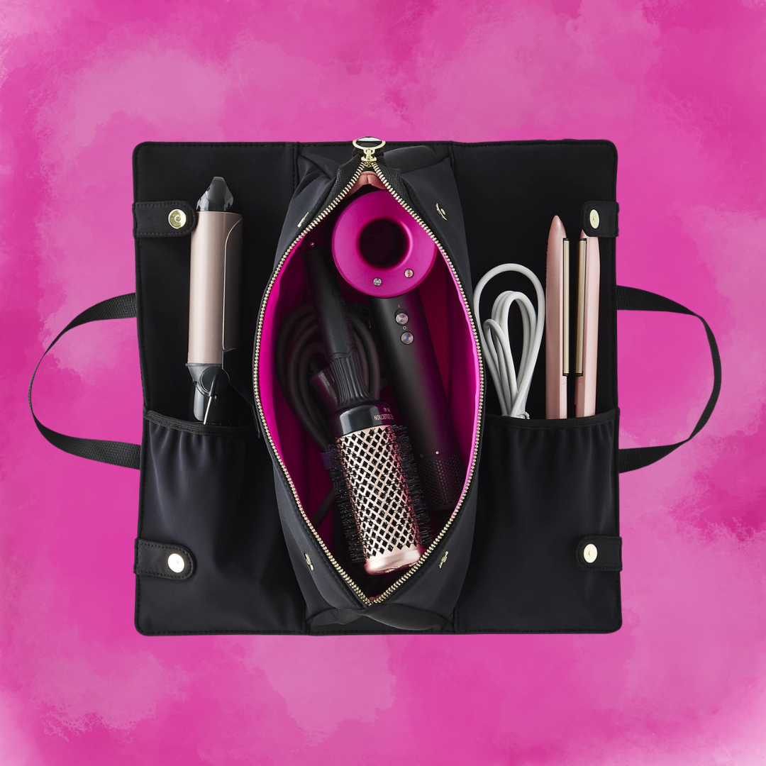 A black bag which opens up to fit a hairdryer, flatiron, and curling iron
