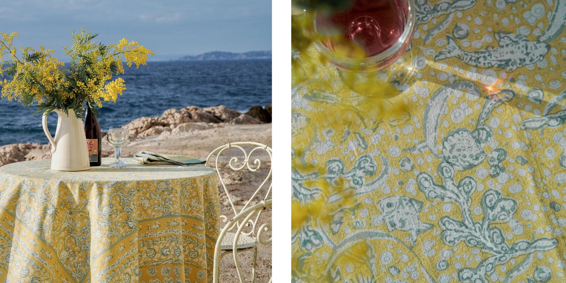 Table with yellow tablecloth on the beach