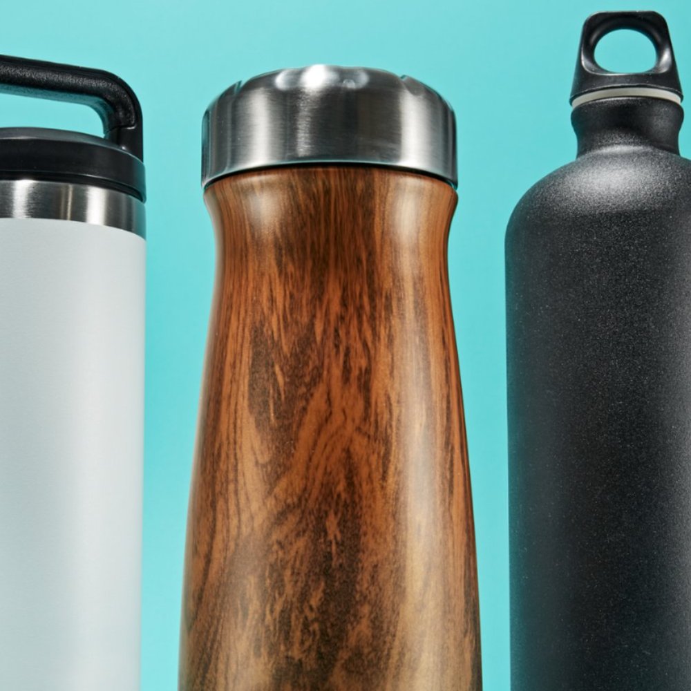 girl filling reusable water bottle