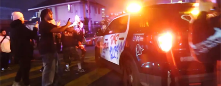 Mob wreaks havoc in downtown L.A., tagging buildings and trains as someone breathes fire