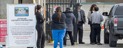 Family members and others wait for news of loved ones at Glass House Farms in Camarillo.