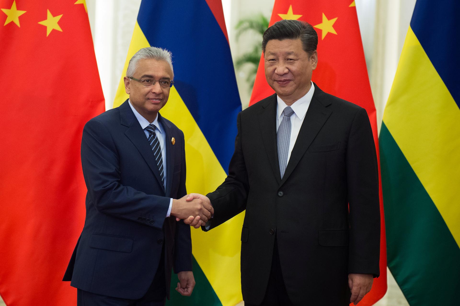Mauritius Prime Minister Pravind Kumar Jugnauth shakes hands with China's President Xi Jinping before their bilateral meeting at the Great Hall of the People in Beijing, China September 2, 2018.
