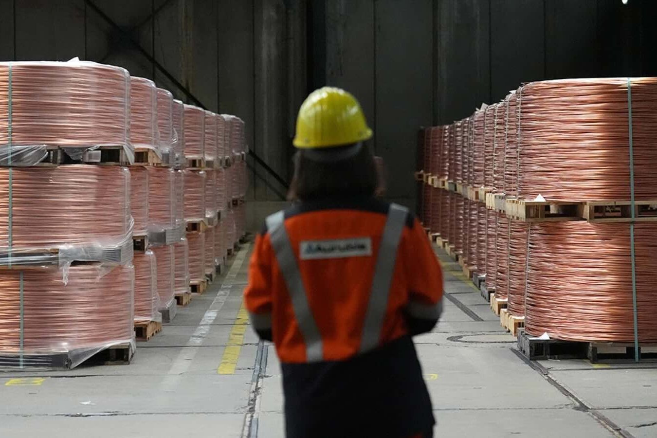 Coiled copper wires lie on pallets in the wire plant at Aurubis AG, in Hamburg, Germany, July 16, 2015. 