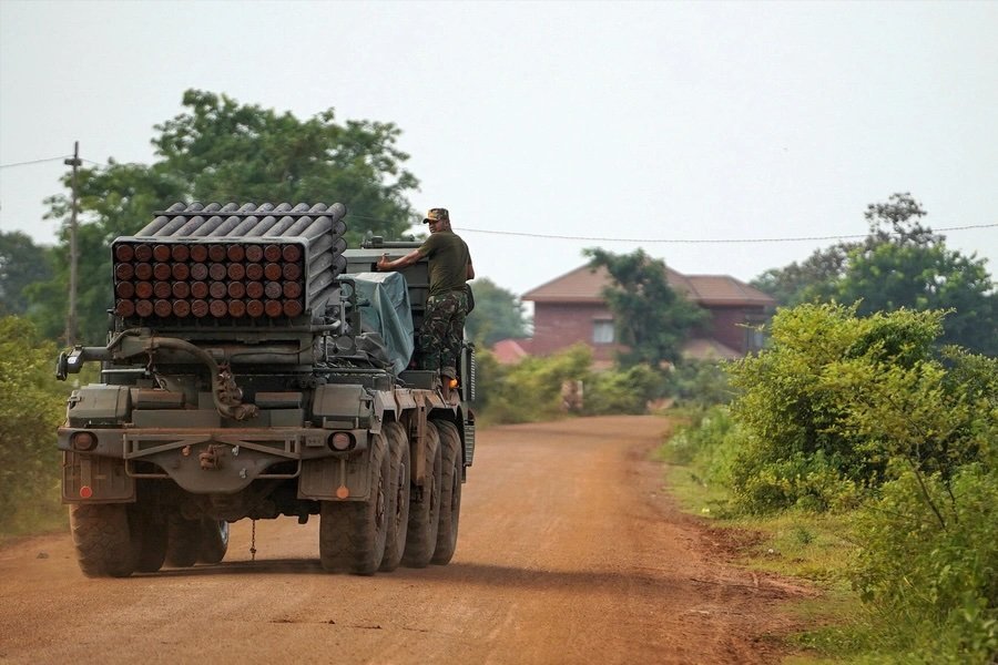 A Cambodian military personnel stands on a BM-21 Grad multiple rocket launcher in Oddar Meanchey province, Cambodia, on July 25, 2025. 