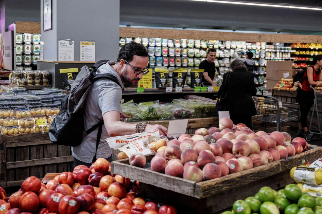 A person shops for groceries in New York City, U.S., July 15, 2025. REUTERS/Jeenah Moon