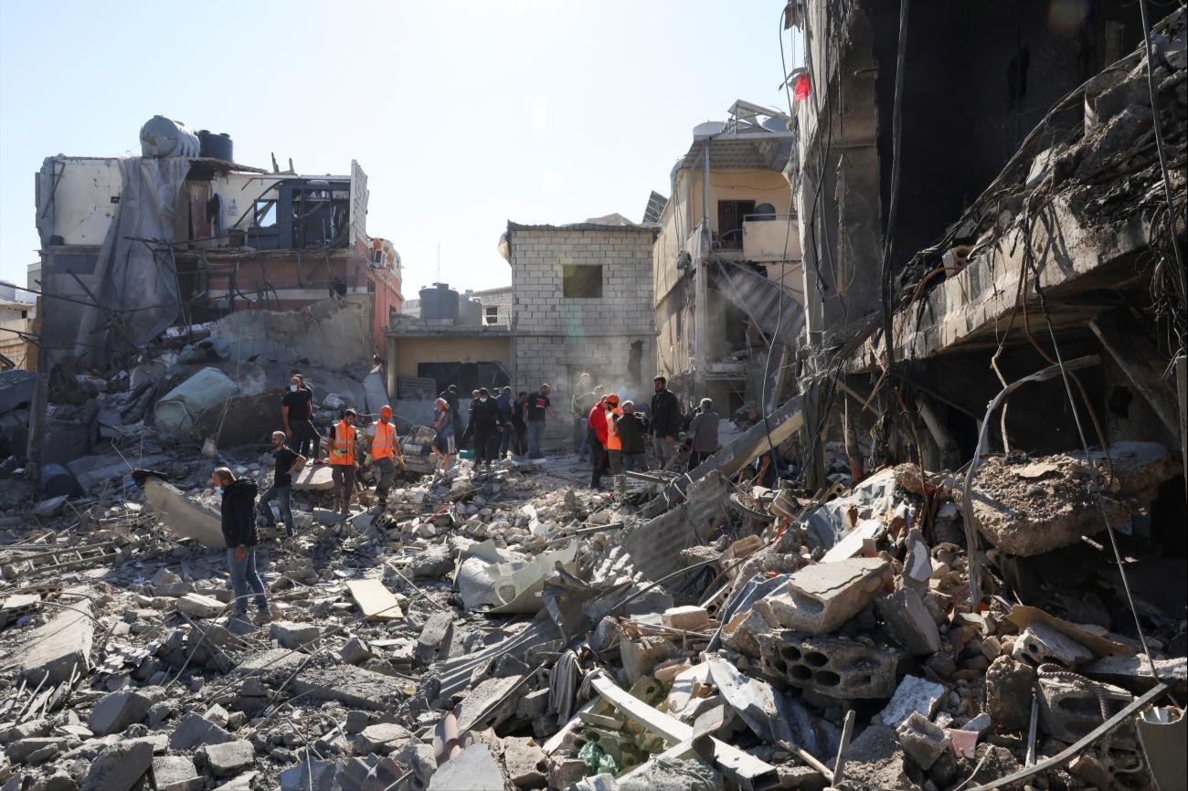 Rescuers search for survivors at the site of an Israeli strike near Rafik Hariri University Hospital, in Beirut, Lebanon, on October 22, 2024.
