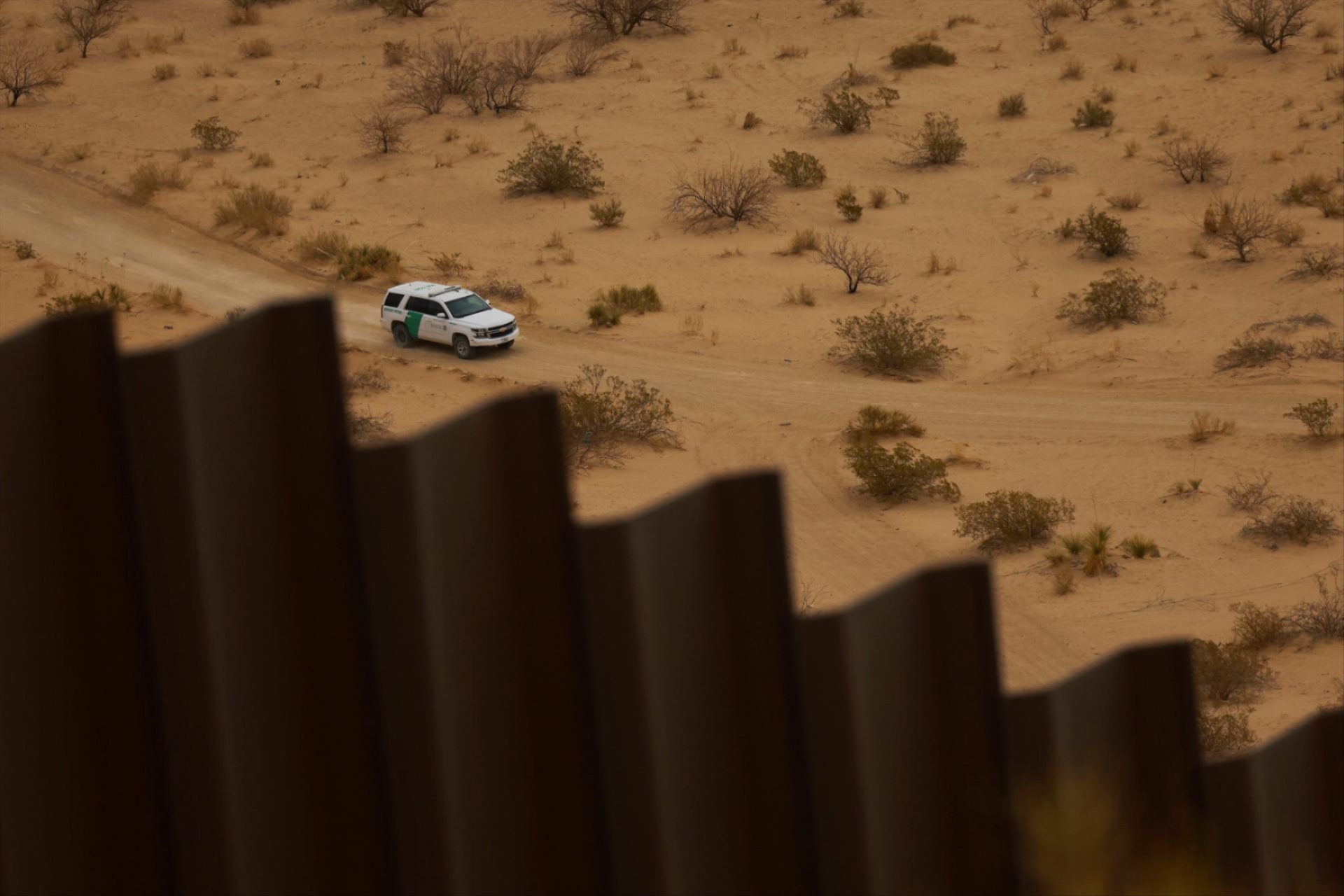A U.S. Border Patrol vehicle conducts surveillance near a section of the U.S.-Mexico border wall, as seen from Ciudad Juarez, Mexico, March 27, 2025.