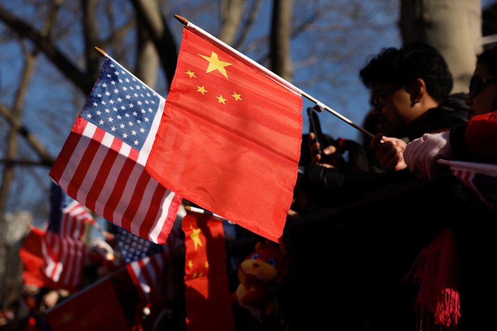 People hold U.S. and China flags as they attend a celebration of the Lunar New Year, in the Chinatown section of Manhattan in New York City, U.S., January 29, 2025. (Shannon Stapleton/Reuters)