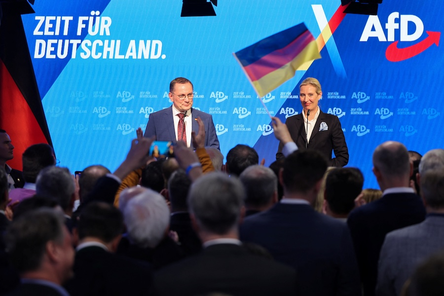 Candidate for Chancellor and co-leader of Germany's far-right Alternative for Germany (AfD) party, Alice Weidel and co-leader of AfD Tino Chrupalla react after exit polls for the 2025 general election, in Berlin, Germany, February 23, 2025. (Wolfgang Rattay/Reuters)
