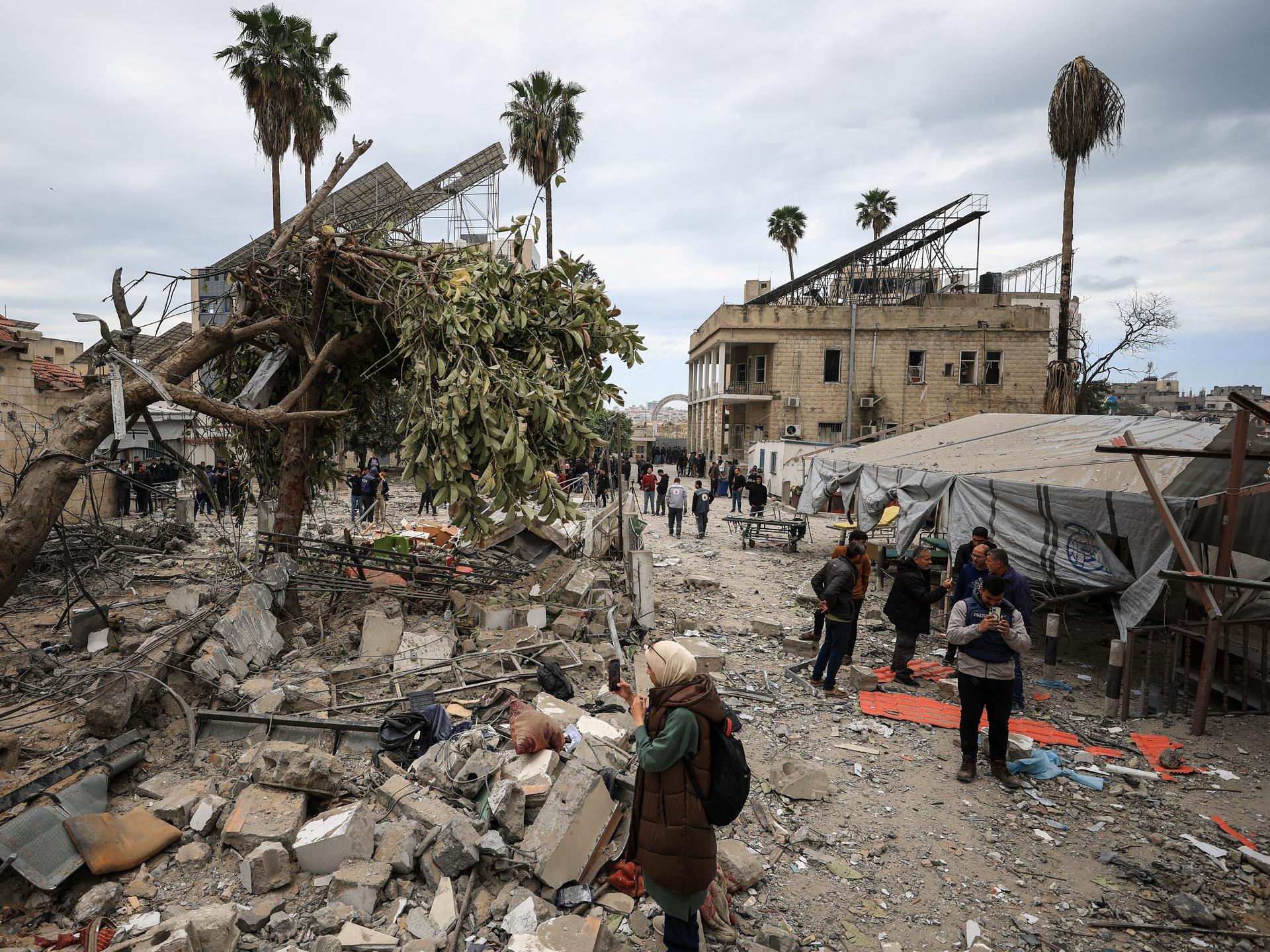 Palestinians inspect the damage after two Israeli missiles hit a building inside the Al-Ahli Arab Baptist Hospital, in the Gaza Strip, on April 13, 2025.t the liquid oxygen storage tank installed at Bir Hospital by the United States Agency for International Development, in Kathmandu, Nepal, on February 9, 2025.