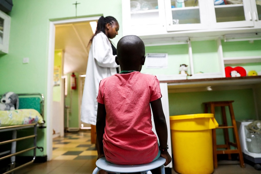 A child sits as a nurse prepares to dispense antiretroviral drugs used to prevent HIV from replicating, at the Nyumbani Children's Home, in Nairobi, Kenya, on February 12, 2025. (Thomas Mukoya/Reuters)