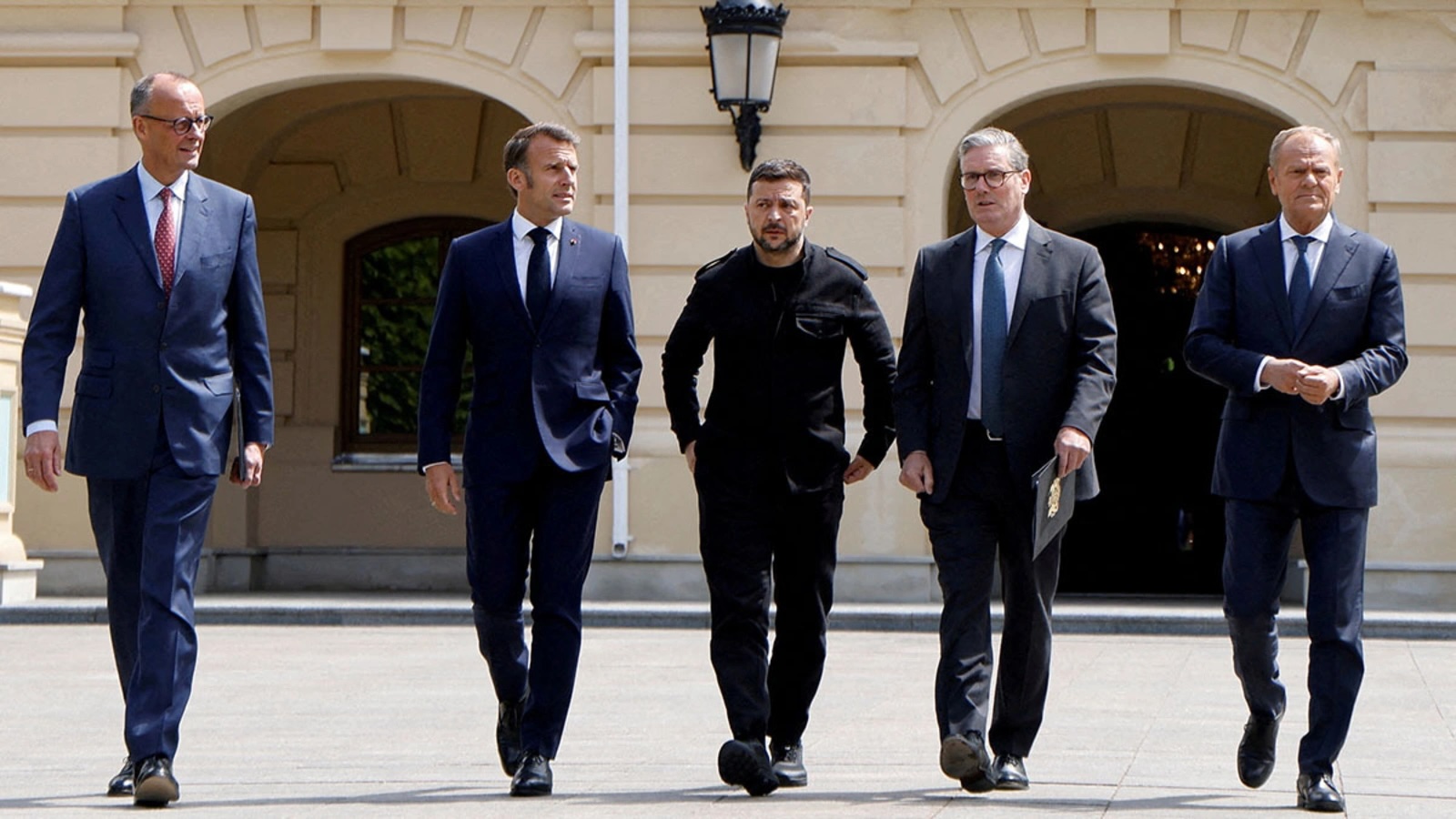 German Chancellor Friedrich Merz, French President Emmanuel Macron, Ukranian President Voloydmyr Zelenskyy, British Prime Minister Keir Starmer and Polish Prime Minister Donald Tusk walk in the grounds of Mariynsky Palace, in Kyiv, Ukraine, on May 10.