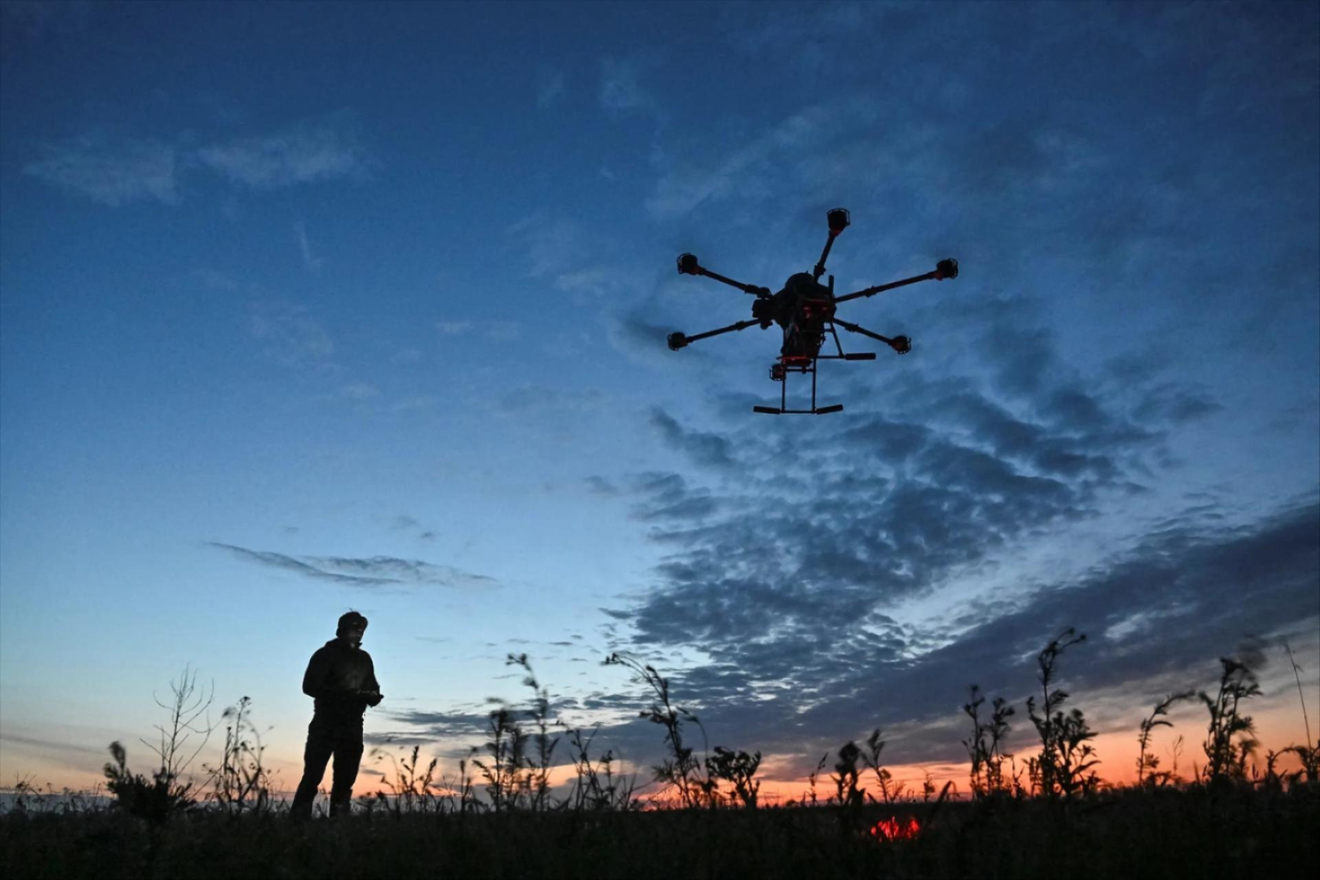 A Ukrainian serviceman launches a combat drone in Zaporizhzhia region, Ukraine, April 2025