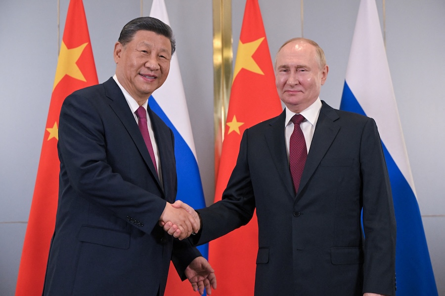 Russian President Vladimir Putin and Chinese President Xi Jinping shake hands during a meeting on the sidelines of the Shanghai Cooperation Organization (SCO) summit in Astana, Kazakhstan July 3, 2024. (Sergei Guneev/Reuters)